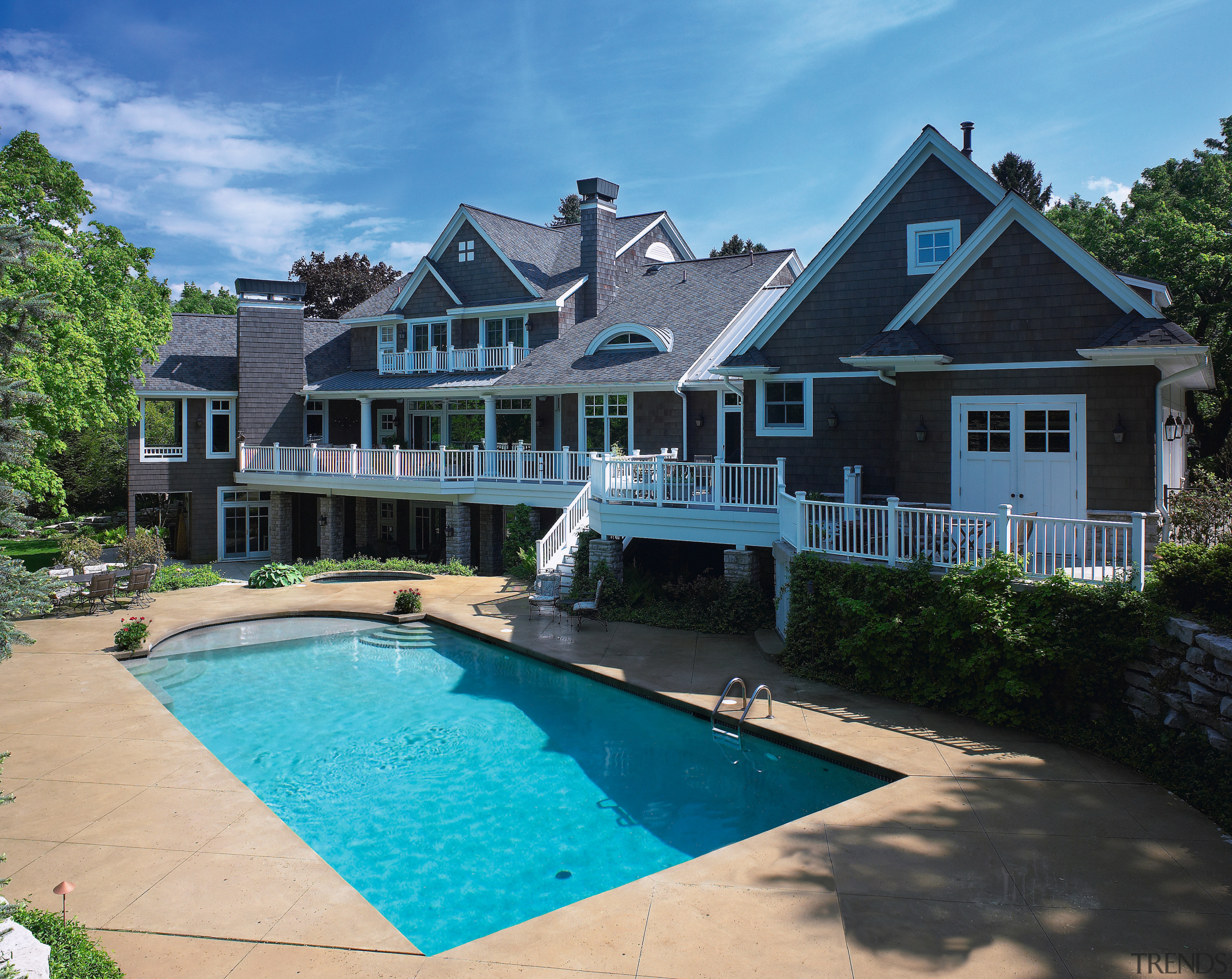 An exterior view of the pool and patio backyard, cottage, estate, home, house, leisure, mansion, property, real estate, residential area, resort, swimming pool, villa, teal, black