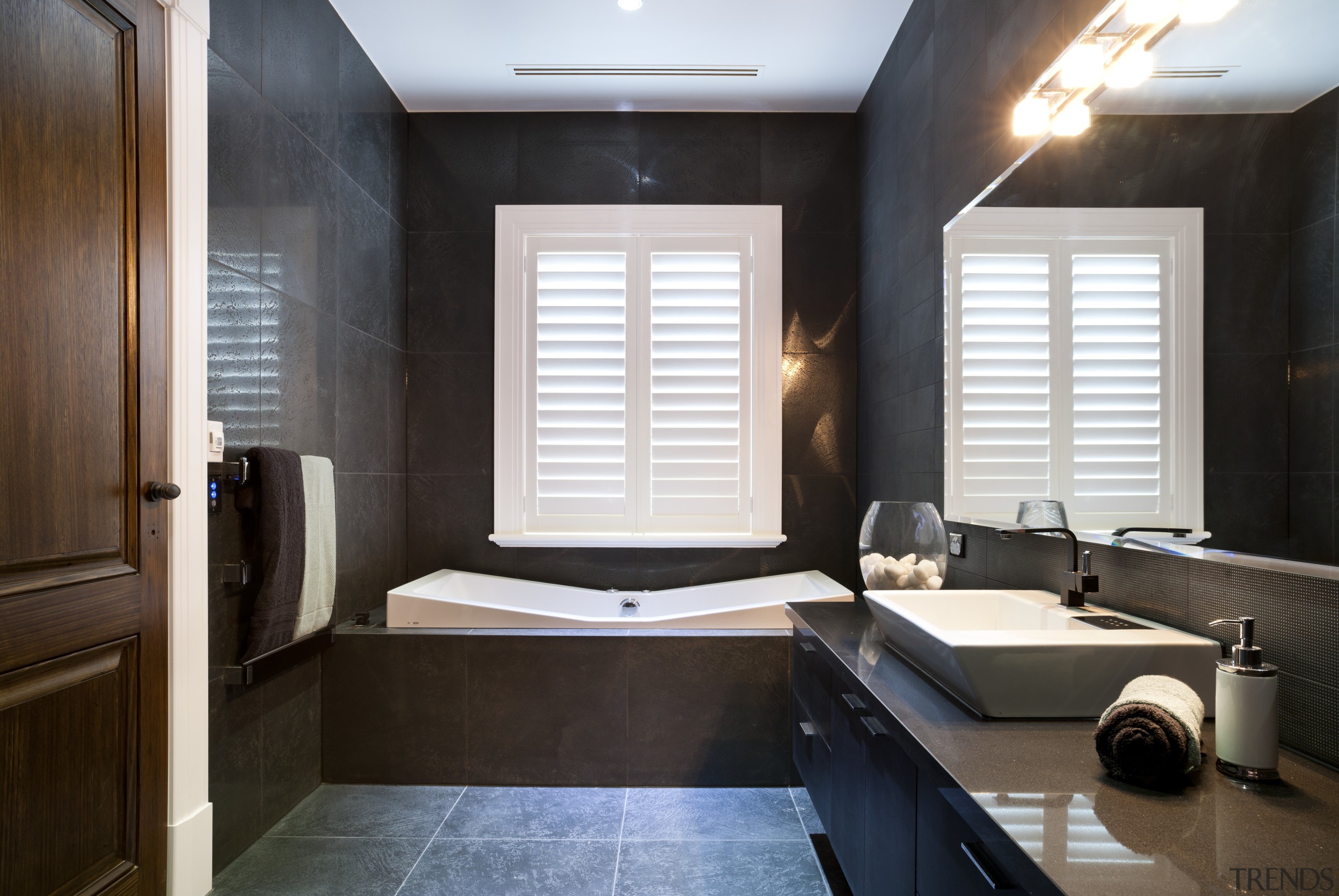 Bathroom with dark grey walls and floors and bathroom, ceiling, floor, interior design, room, window, black, white