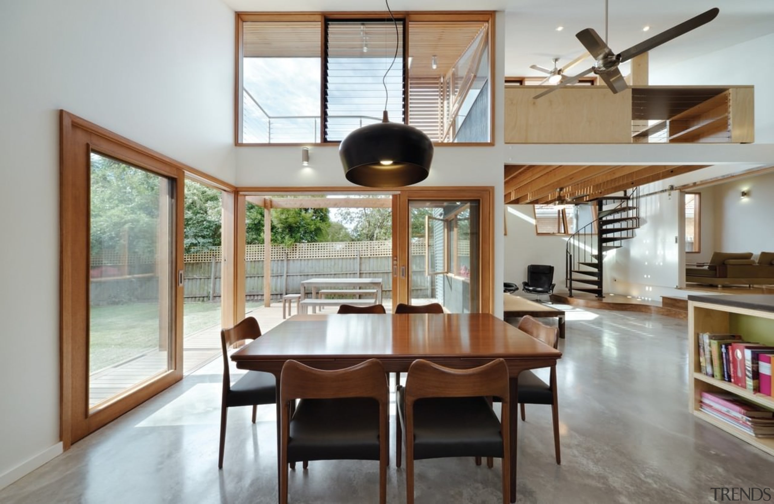 A hanging light provides the focal point for architecture, ceiling, dining room, hardwood, house, interior design, living room, real estate, table, window, gray