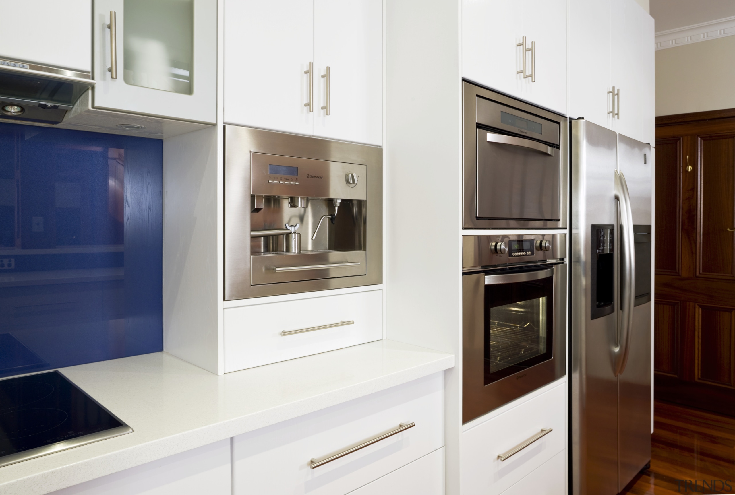 an induction cooktop and slide away rangehood sit cabinetry, countertop, cuisine classique, home appliance, interior design, kitchen, kitchen appliance, major appliance, room, white
