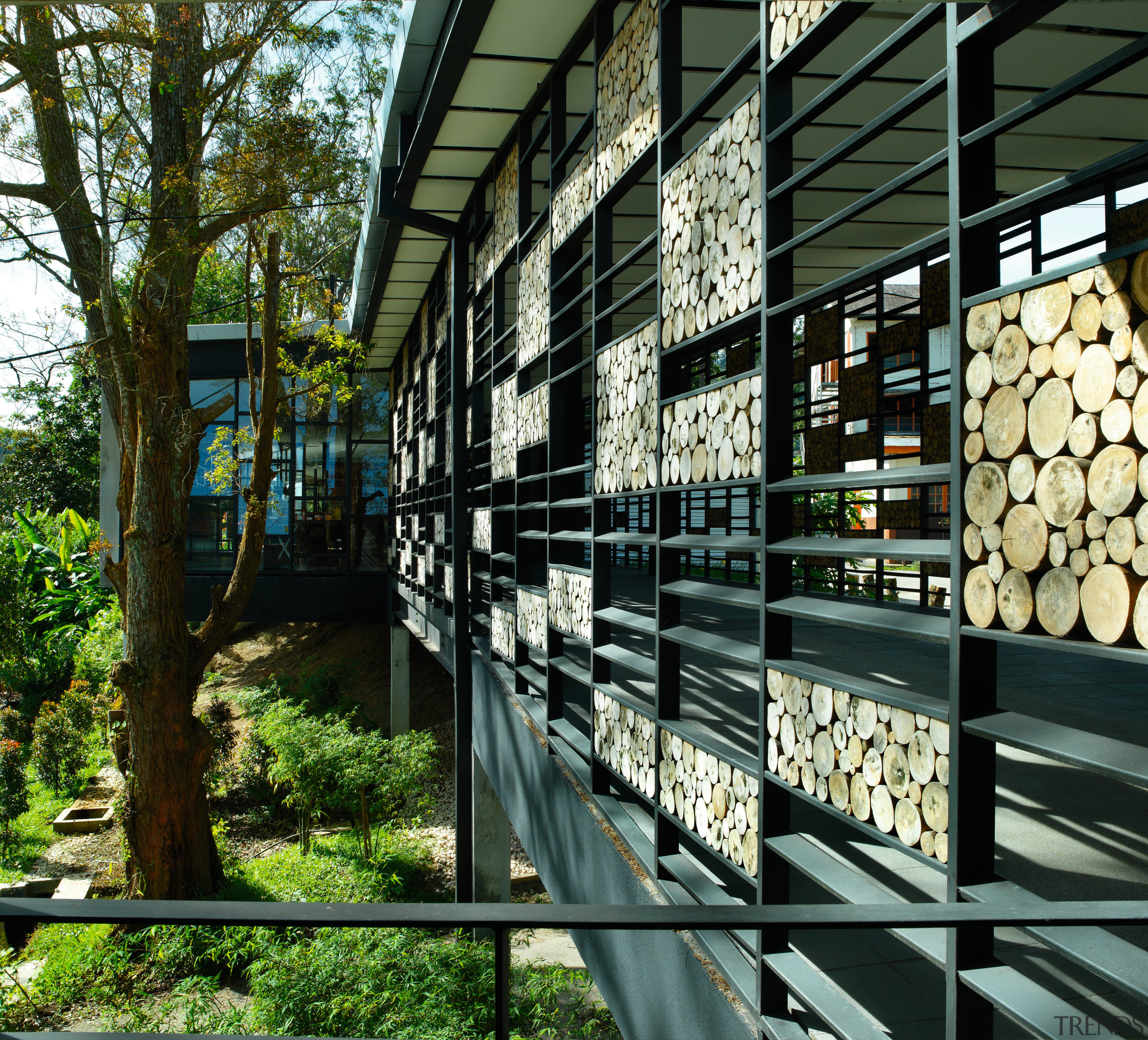 view of the striking design feature, the cladding architecture, plant, tree, black