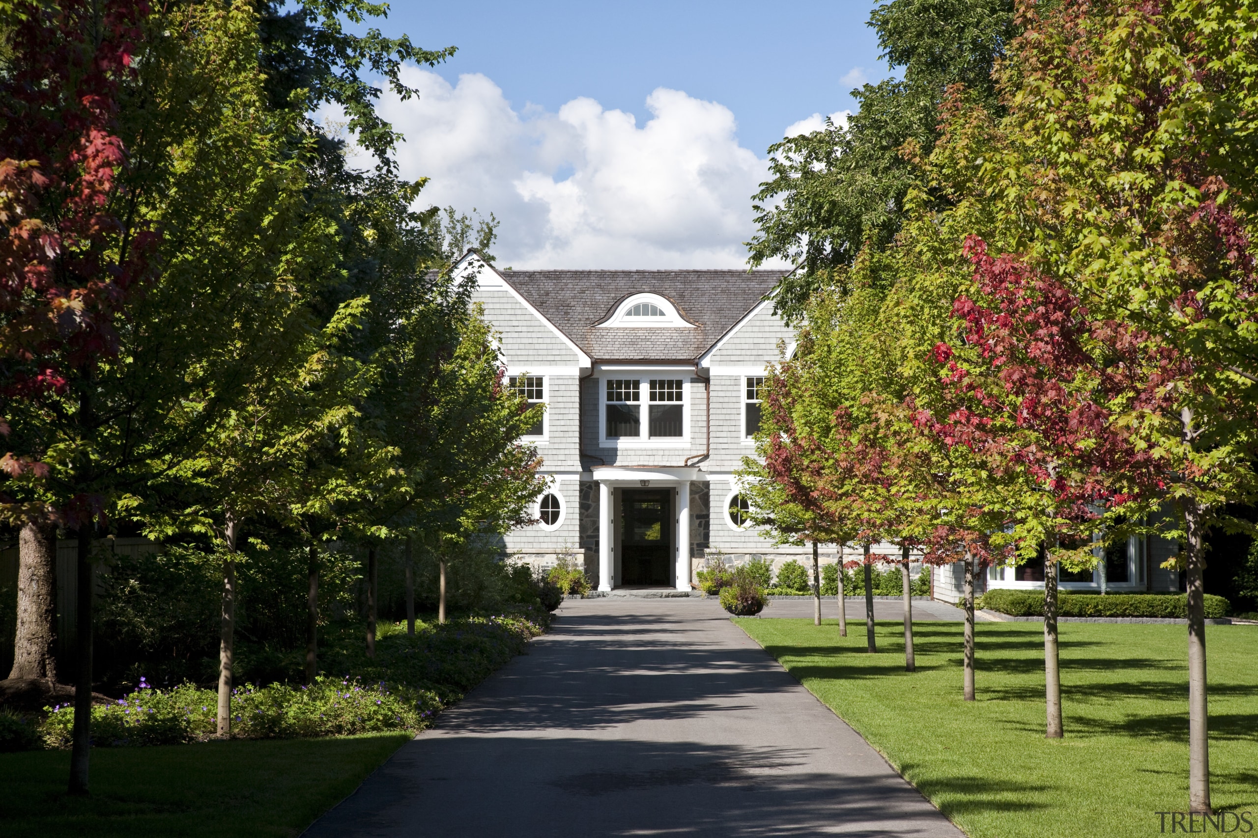 View of the homes exterior featuring stained cider architecture, autumn, building, campus, cottage, estate, farmhouse, garden, grass, home, house, landscape, leaf, mansion, nature, neighbourhood, plant, plantation, property, real estate, residential area, sky, spring, suburb, tree, woody plant, brown