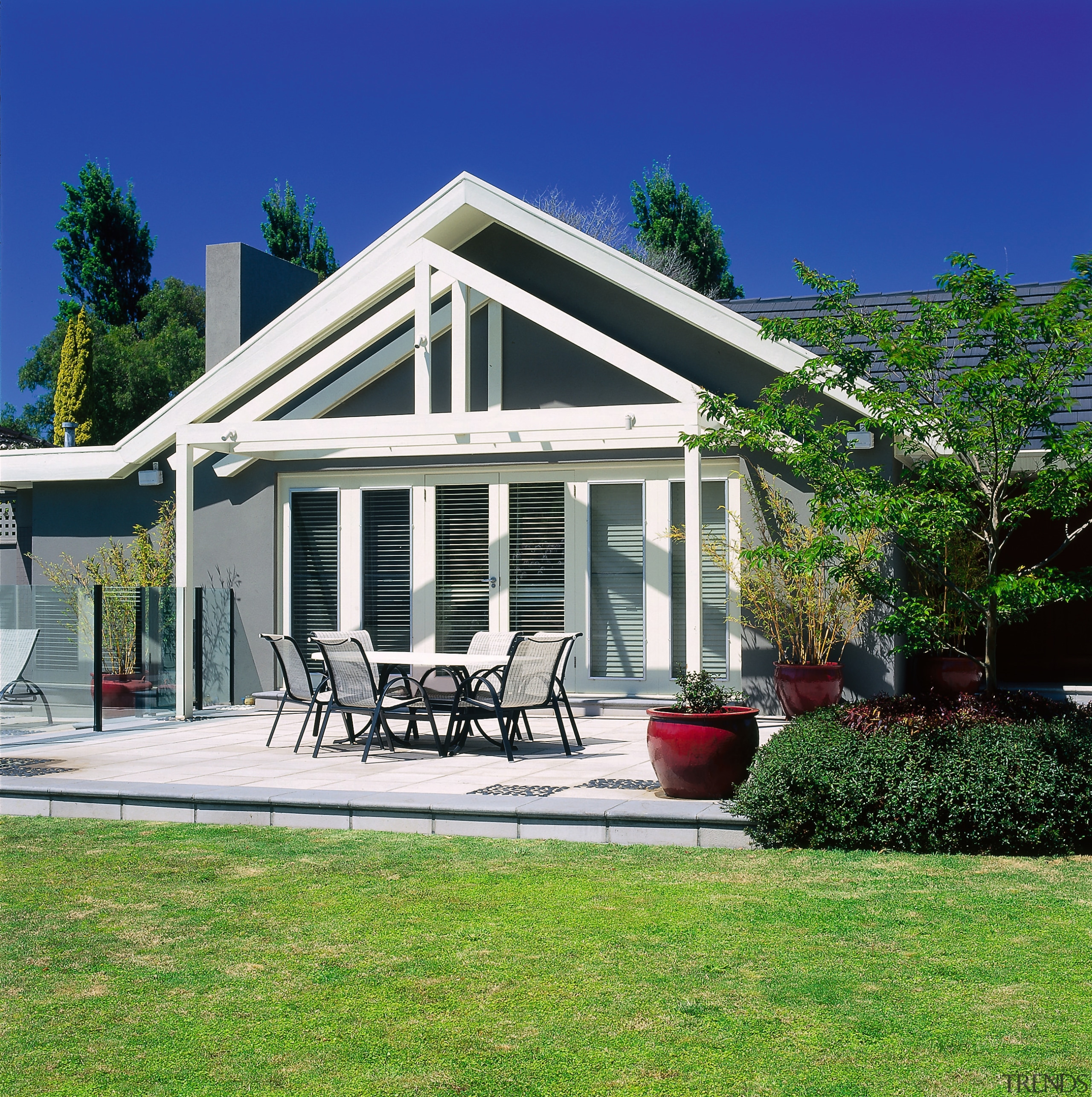 Landscape renovation. Gabled roofline with pergolas over the architecture, backyard, cottage, elevation, estate, facade, farmhouse, home, house, orangery, outdoor structure, property, real estate, residential area, siding, villa, green