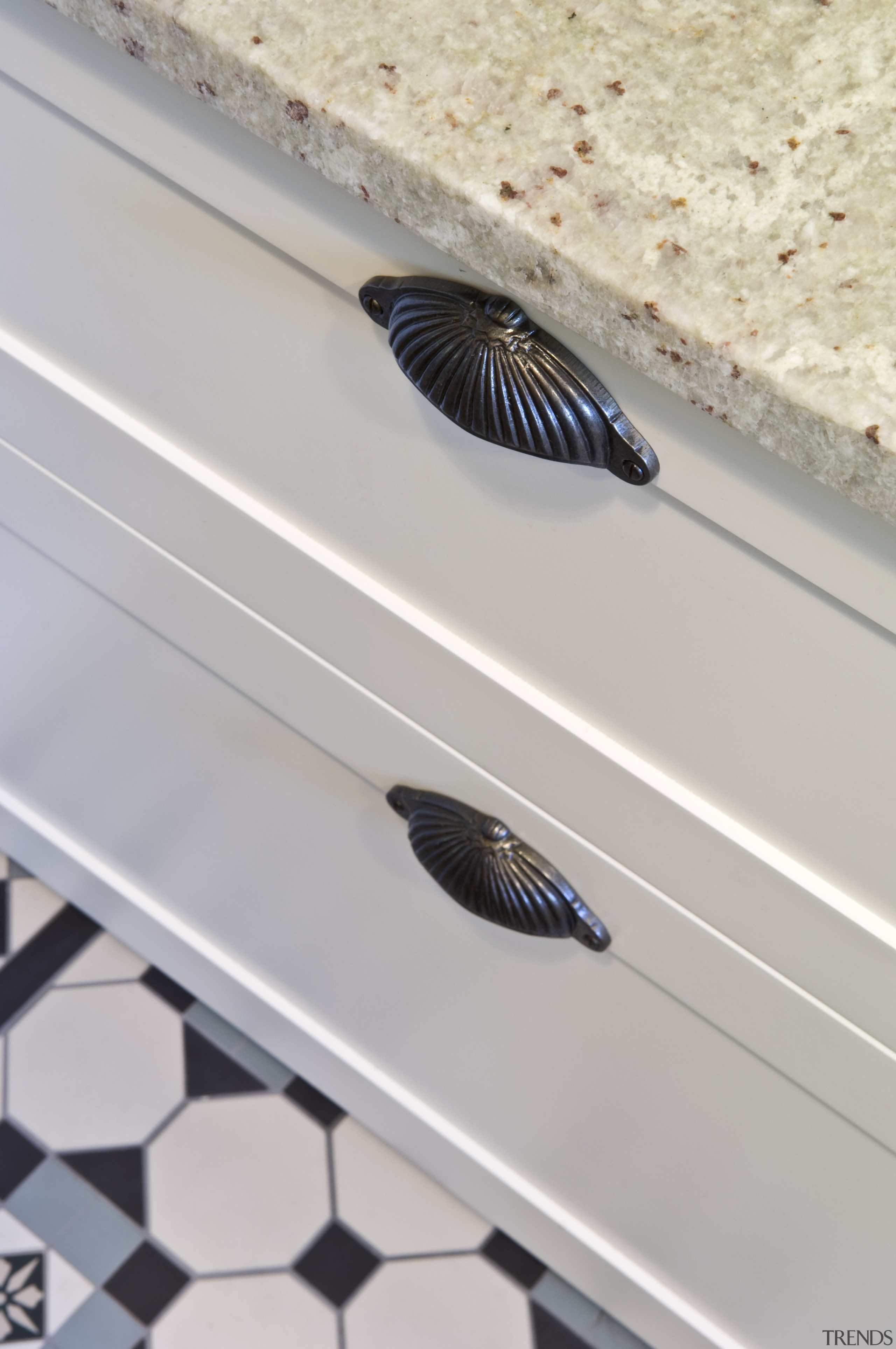 View of laundry, featuring a white butler's sink, floor, product design, gray