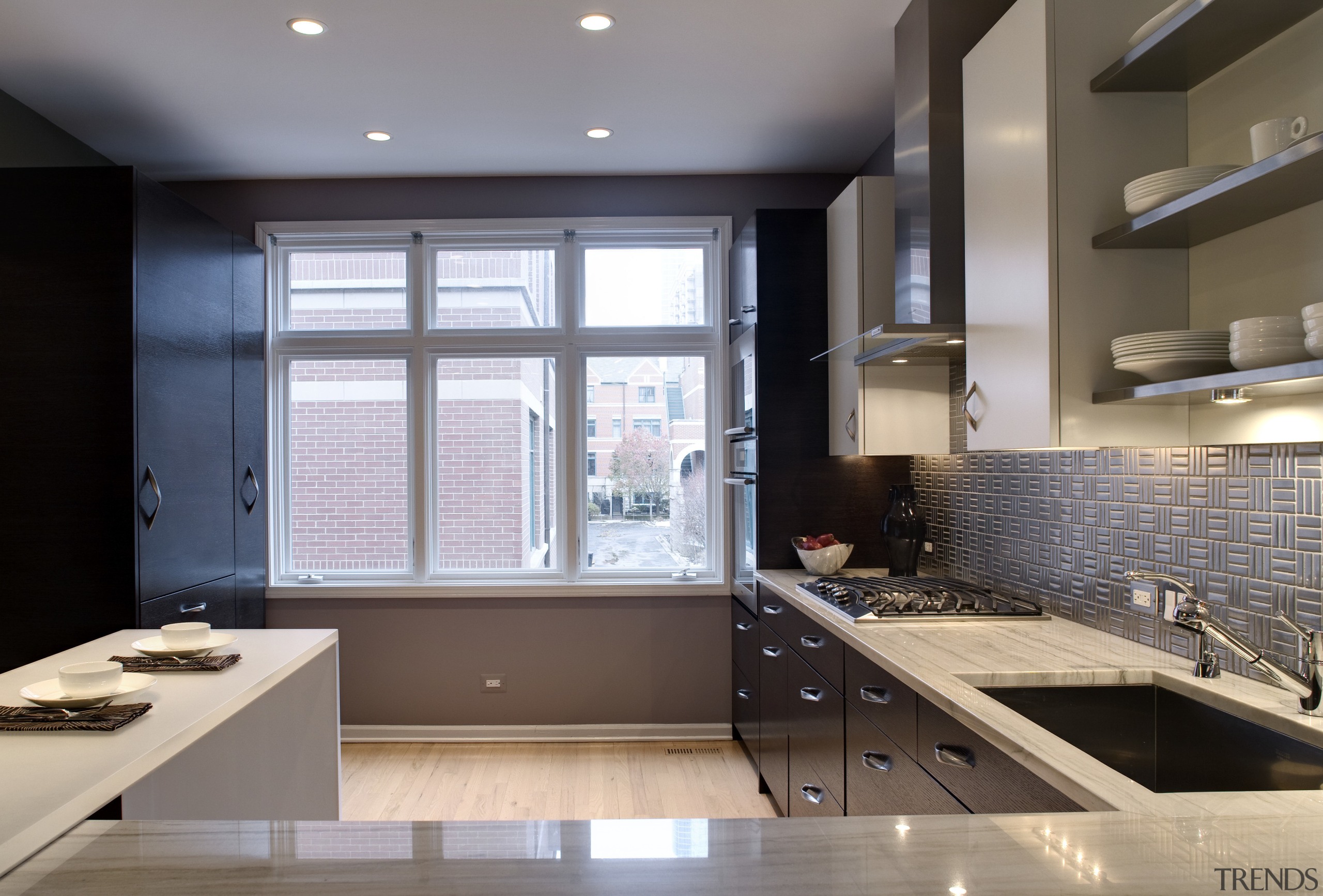 View of a remodelled kitchen which is adjacent cabinetry, countertop, daylighting, interior design, kitchen, room, gray