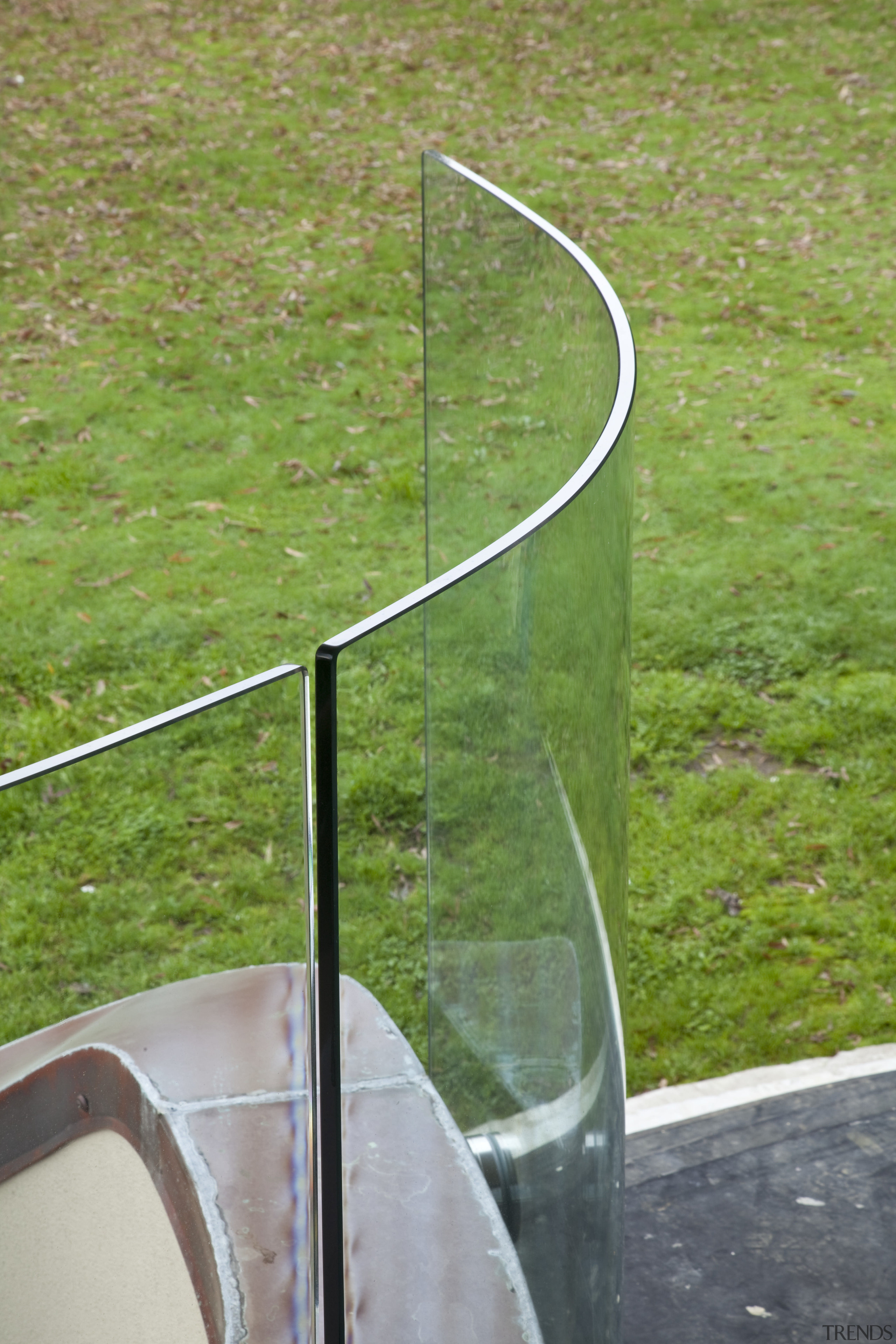 View of home with curved, toughened glass balustrade. grass, lawn, line, plant, tree, green