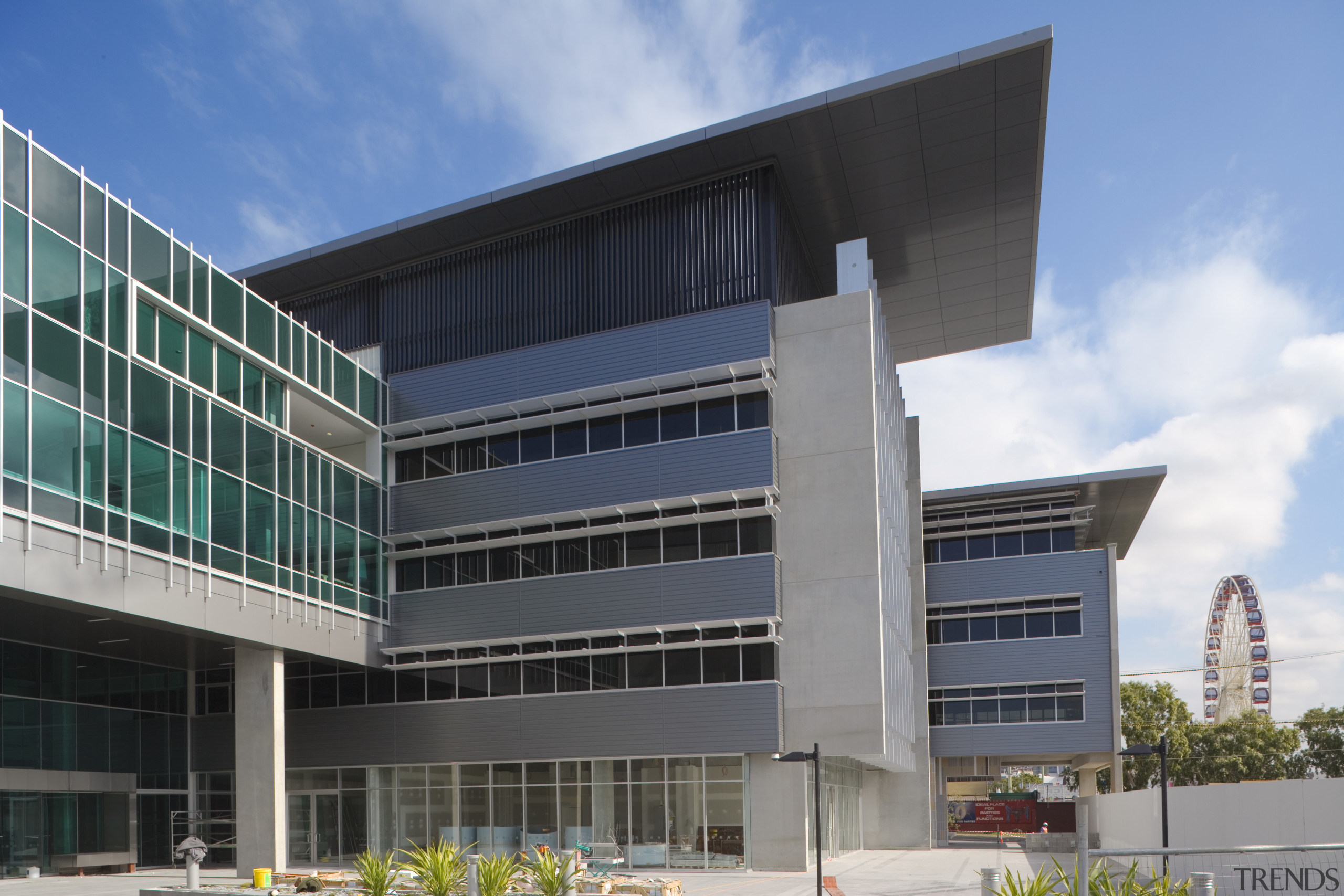 An exterior view of the greensquare building. The architecture, building, commercial building, condominium, corporate headquarters, daytime, elevation, facade, headquarters, metropolitan area, mixed use, real estate, sky, gray, teal