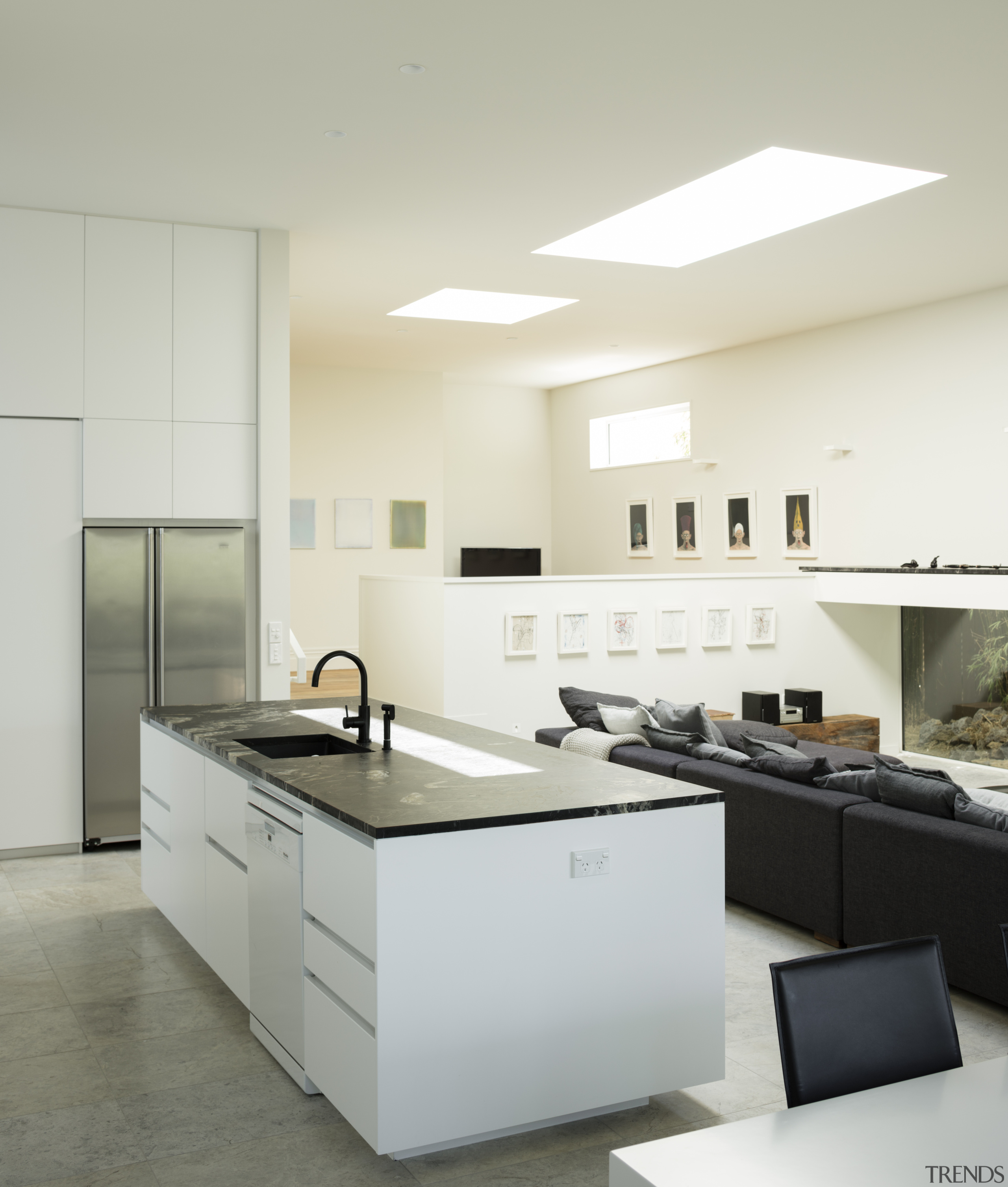 This modern entertainers kitchen is packed with storage countertop, daylighting, floor, interior design, kitchen, product design, sink, gray