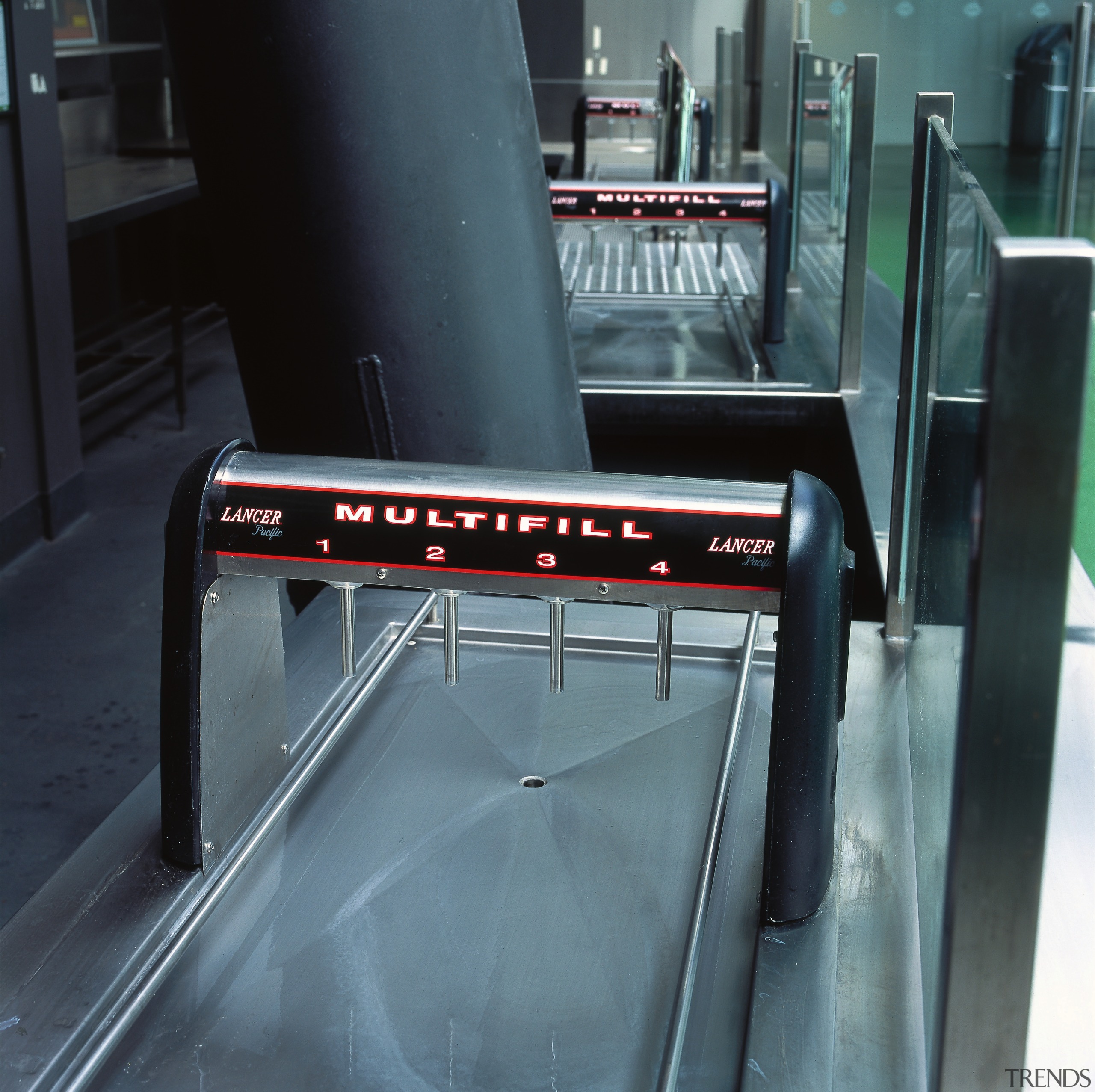 View of Lancer Multifill drink dispensing equipment. automotive exterior, furniture, product, structure, table, black, gray