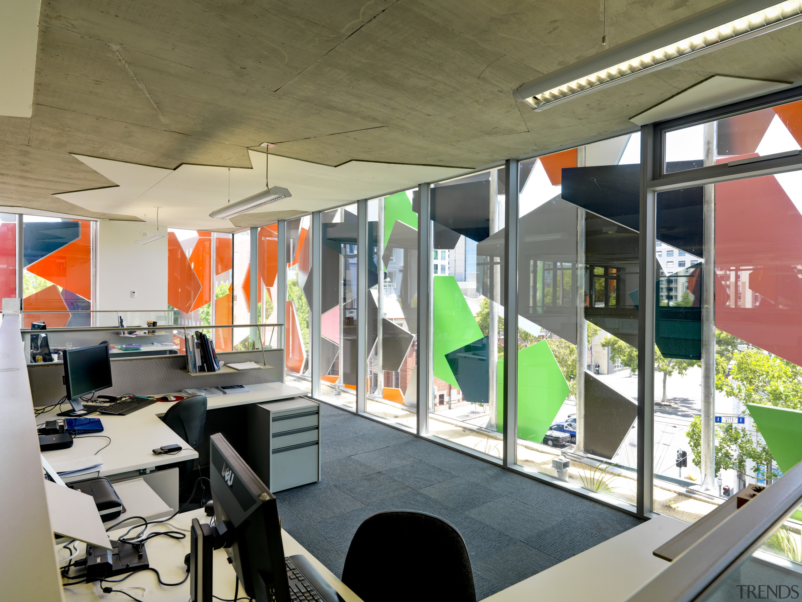 View of Pixel Building, with colorful exterior flags, interior design, office