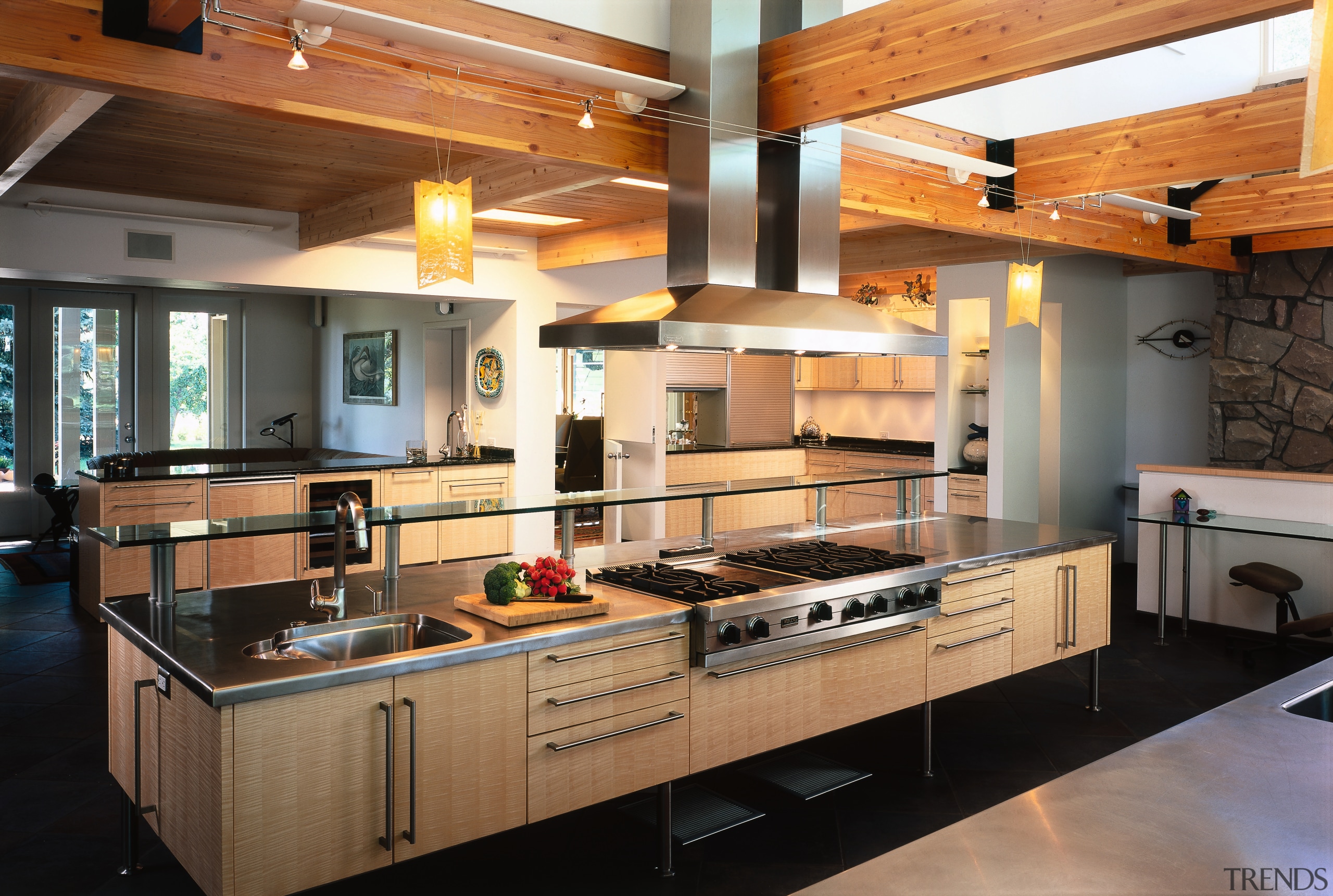 view of the kitchen island showing stainless cooktop countertop, interior design, kitchen, black