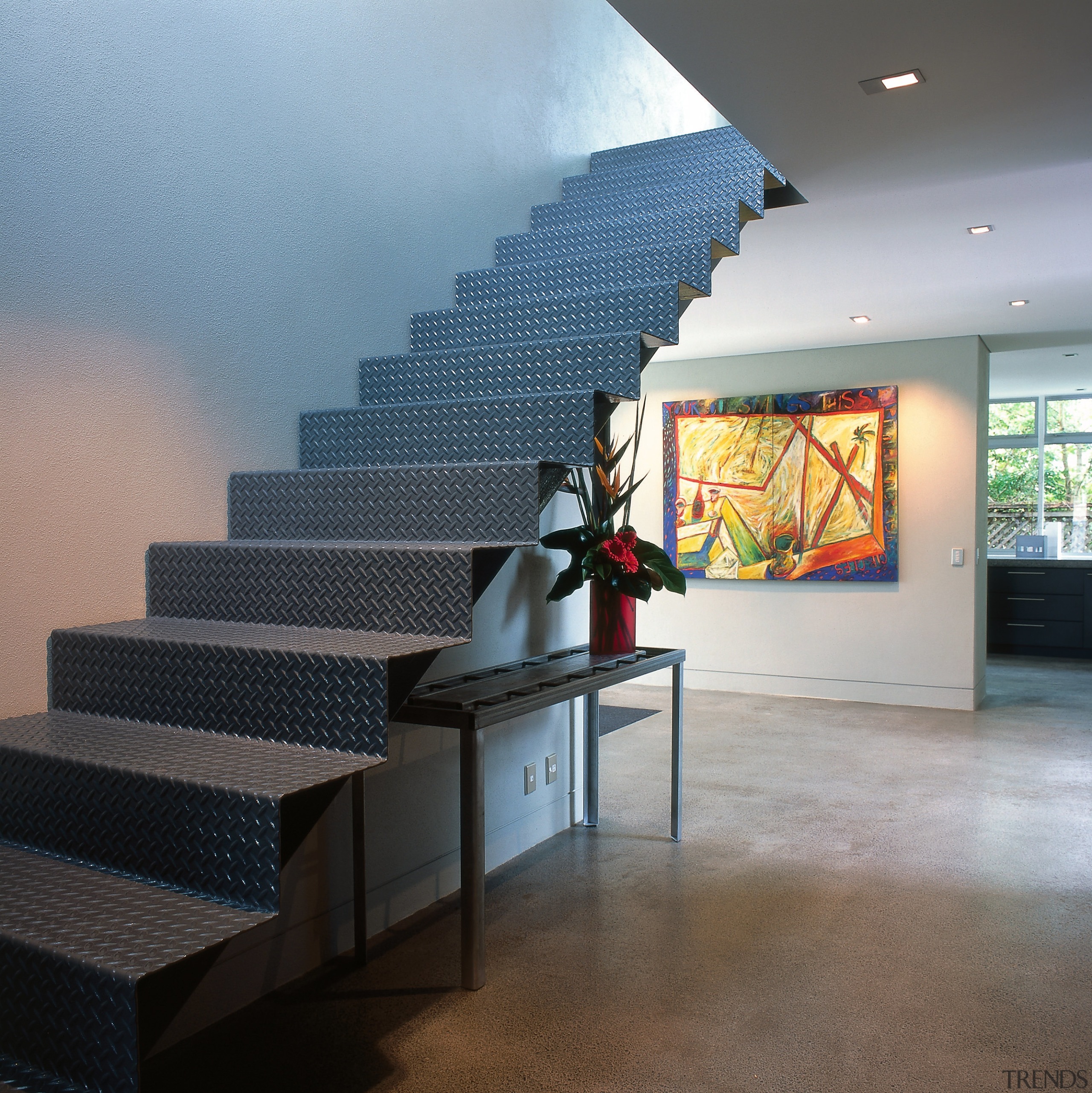 View of a steel staircase, polished concrete floor, architecture, daylighting, floor, handrail, interior design, stairs, tourist attraction, wall, gray