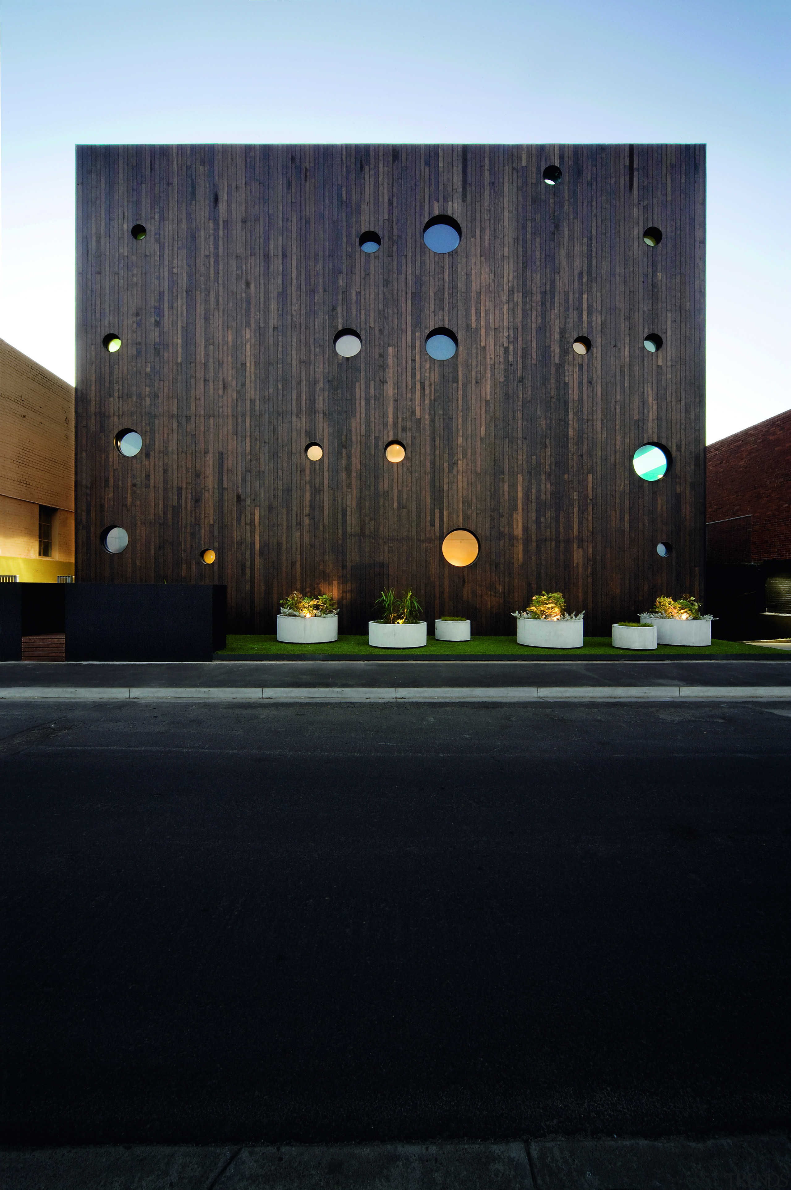 Exterior view of the Hue apartment building which architecture, building, facade, house, reflection, sky, sunlight, wall, wood, black