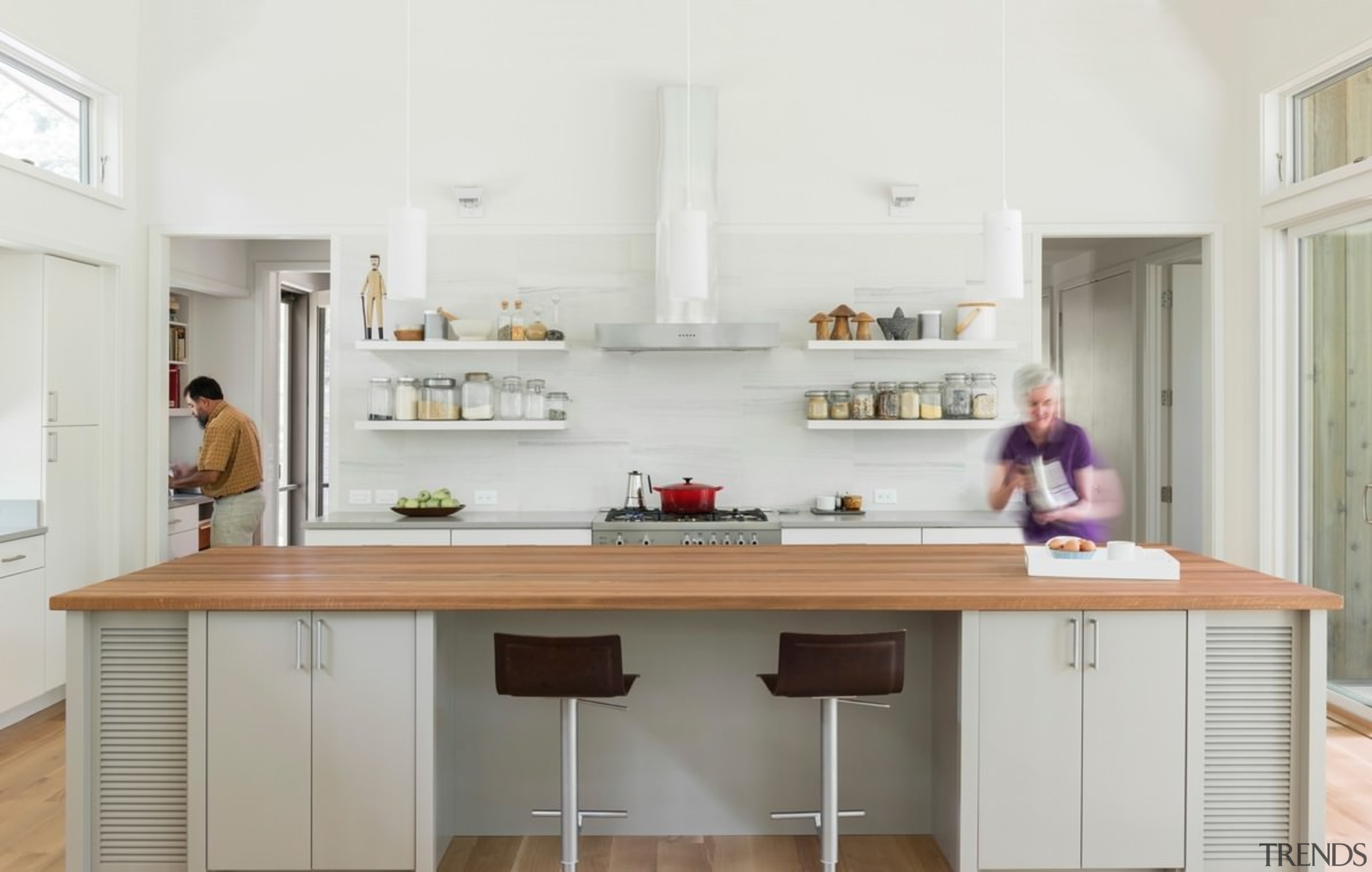 The light-filled kitchen has a separate scullery and cabinetry, countertop, cuisine classique, furniture, interior design, kitchen, room, white, gray