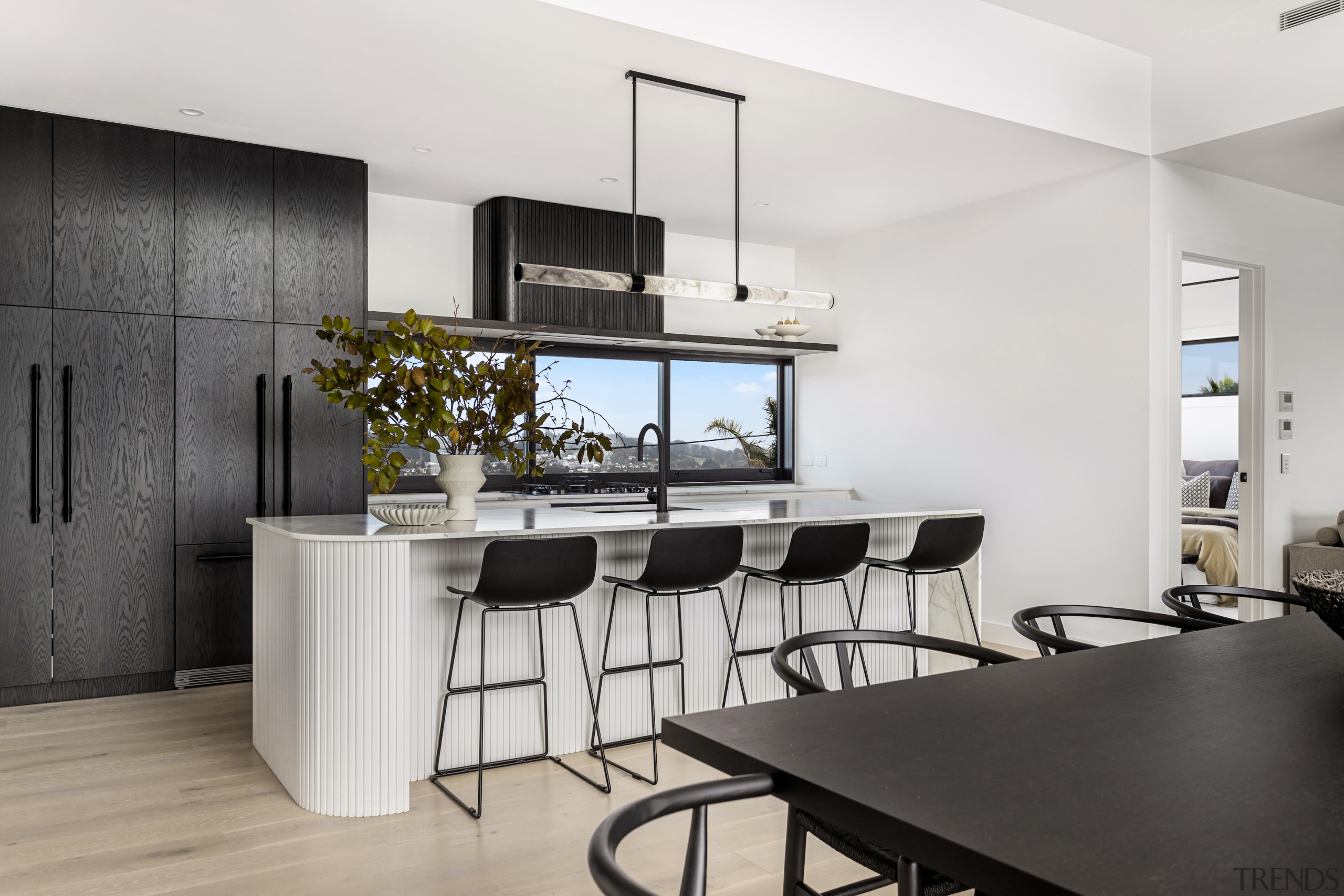 The dramatic black/white kitchen with fluting on the 