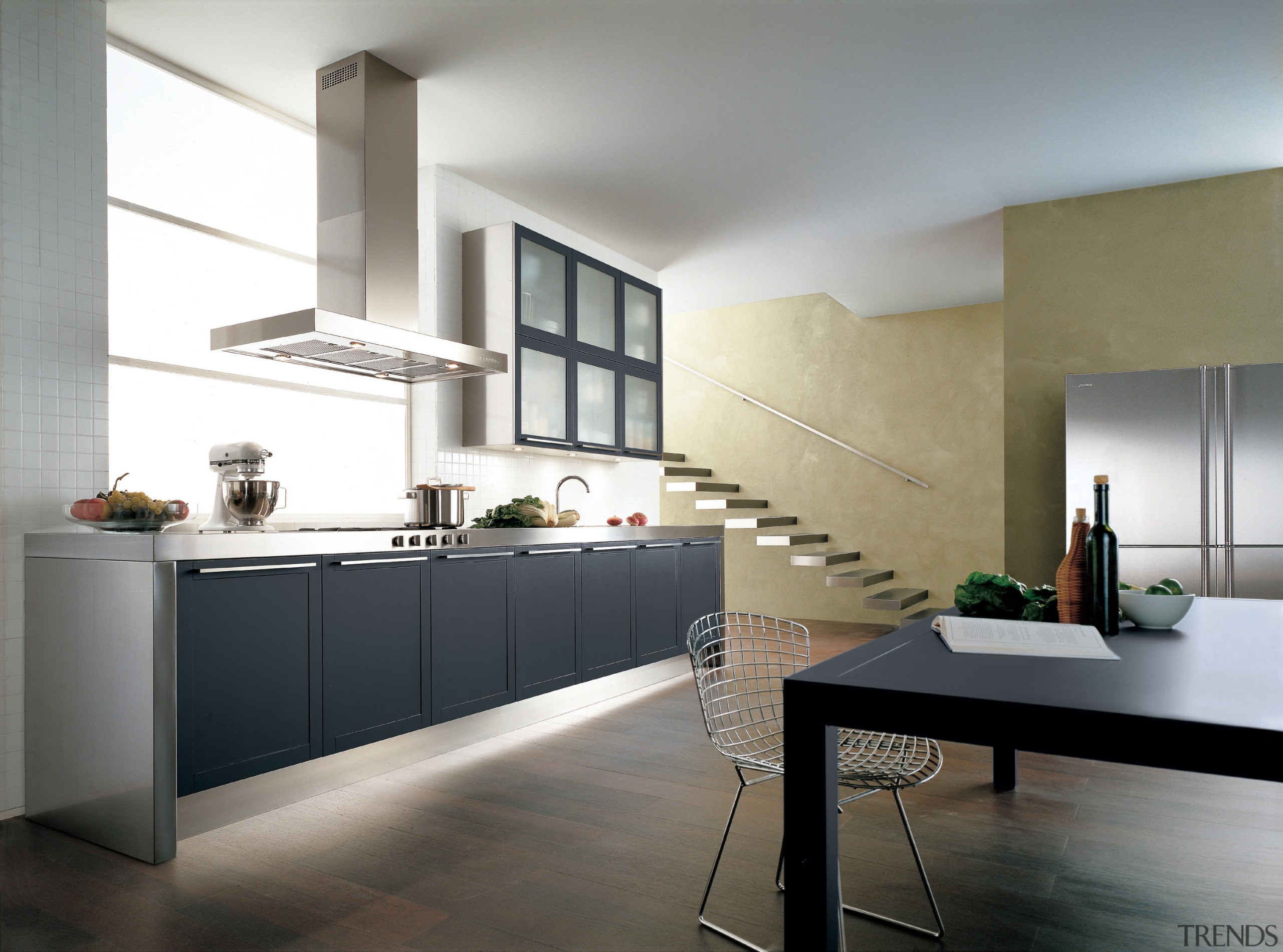 Kitchen with black cupboard doors and stainless steel cabinetry, countertop, cuisine classique, floor, flooring, furniture, interior design, interior designer, kitchen, product design, gray