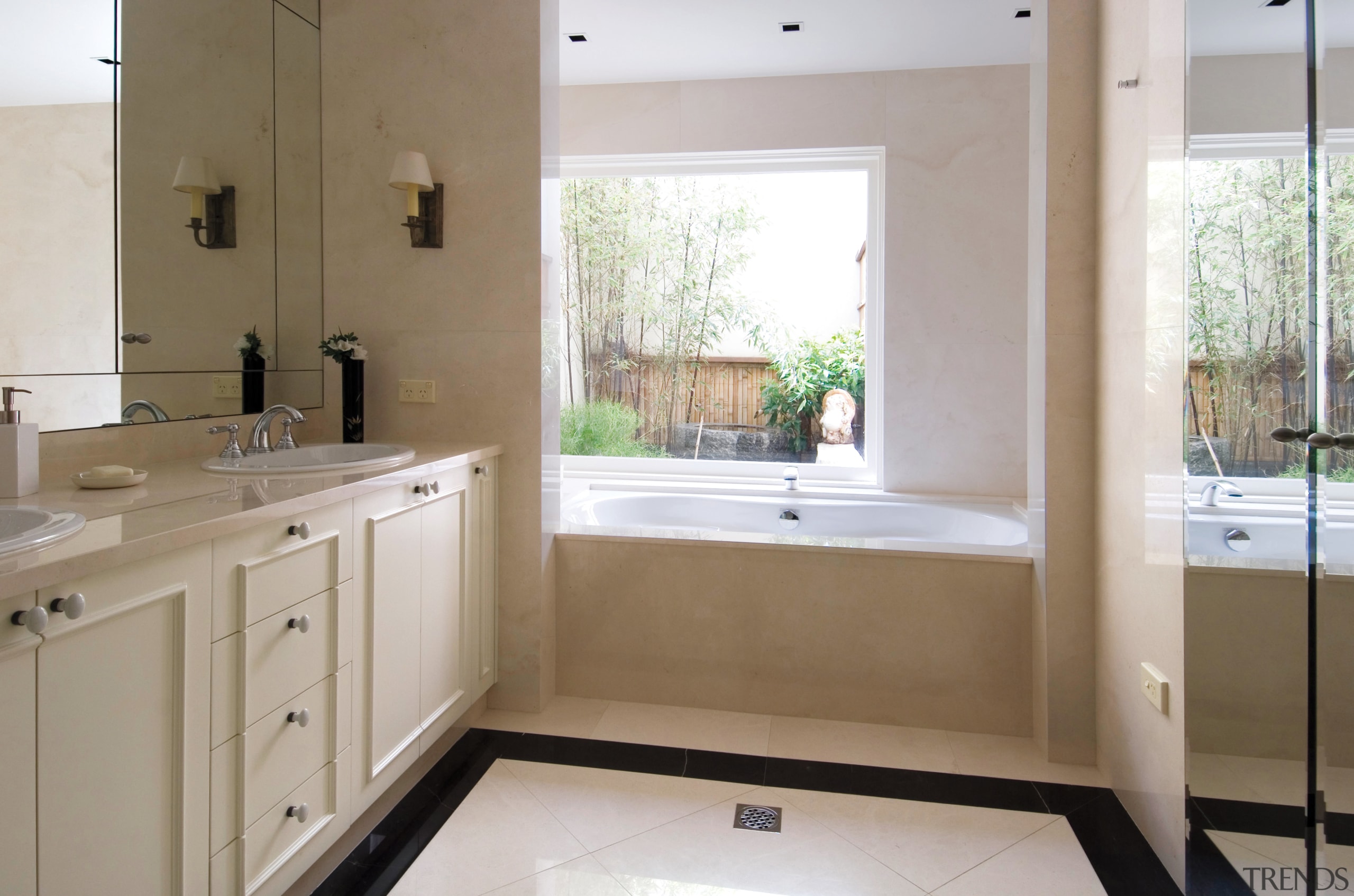 A view of the master bathroom featuring recessed bathroom, countertop, floor, home, interior design, kitchen, property, real estate, room, sink, window, gray, brown