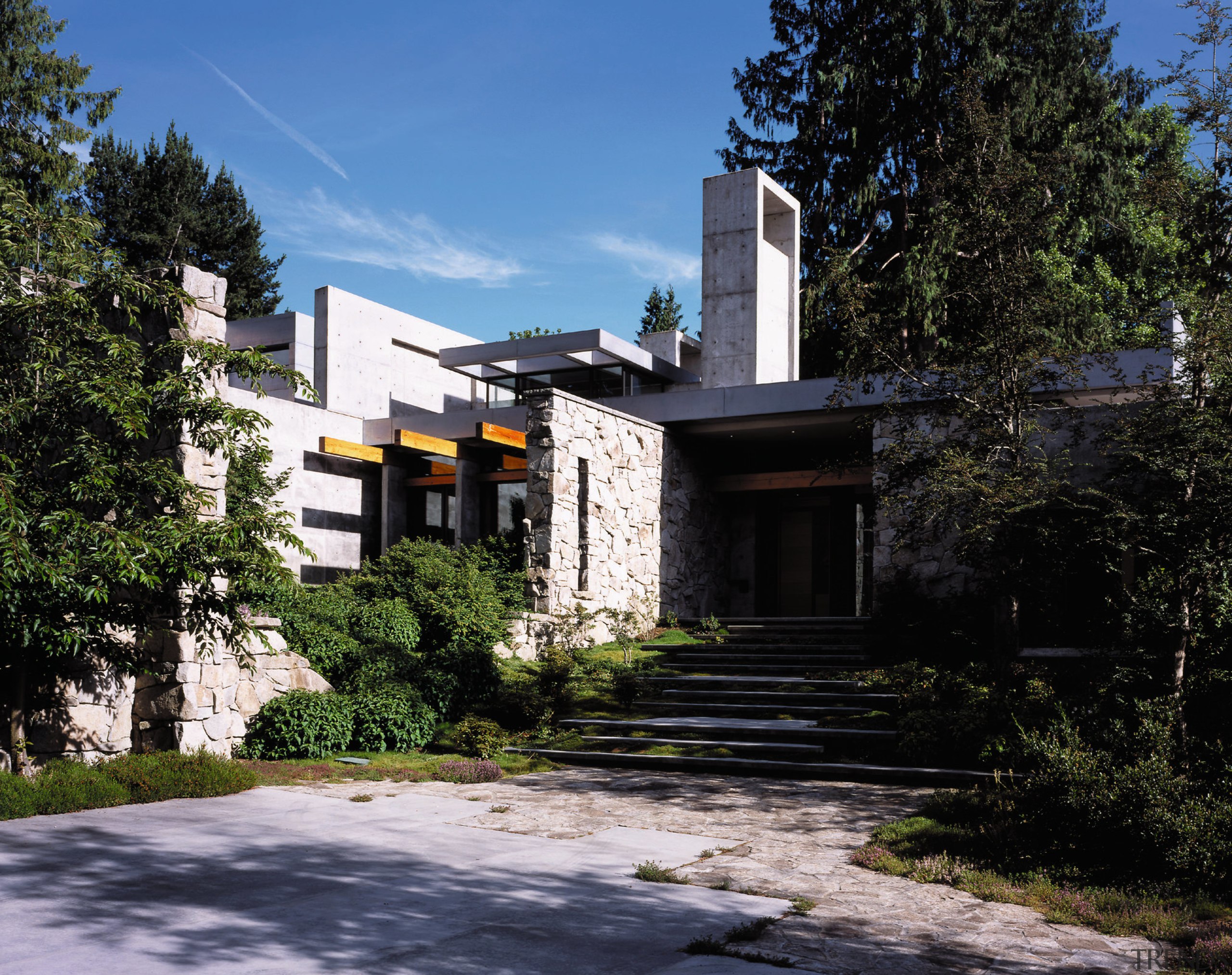 View of this modern house showing entrance way architecture, building, cottage, estate, facade, home, house, mansion, neighbourhood, plant, property, real estate, residential area, sky, tree, black