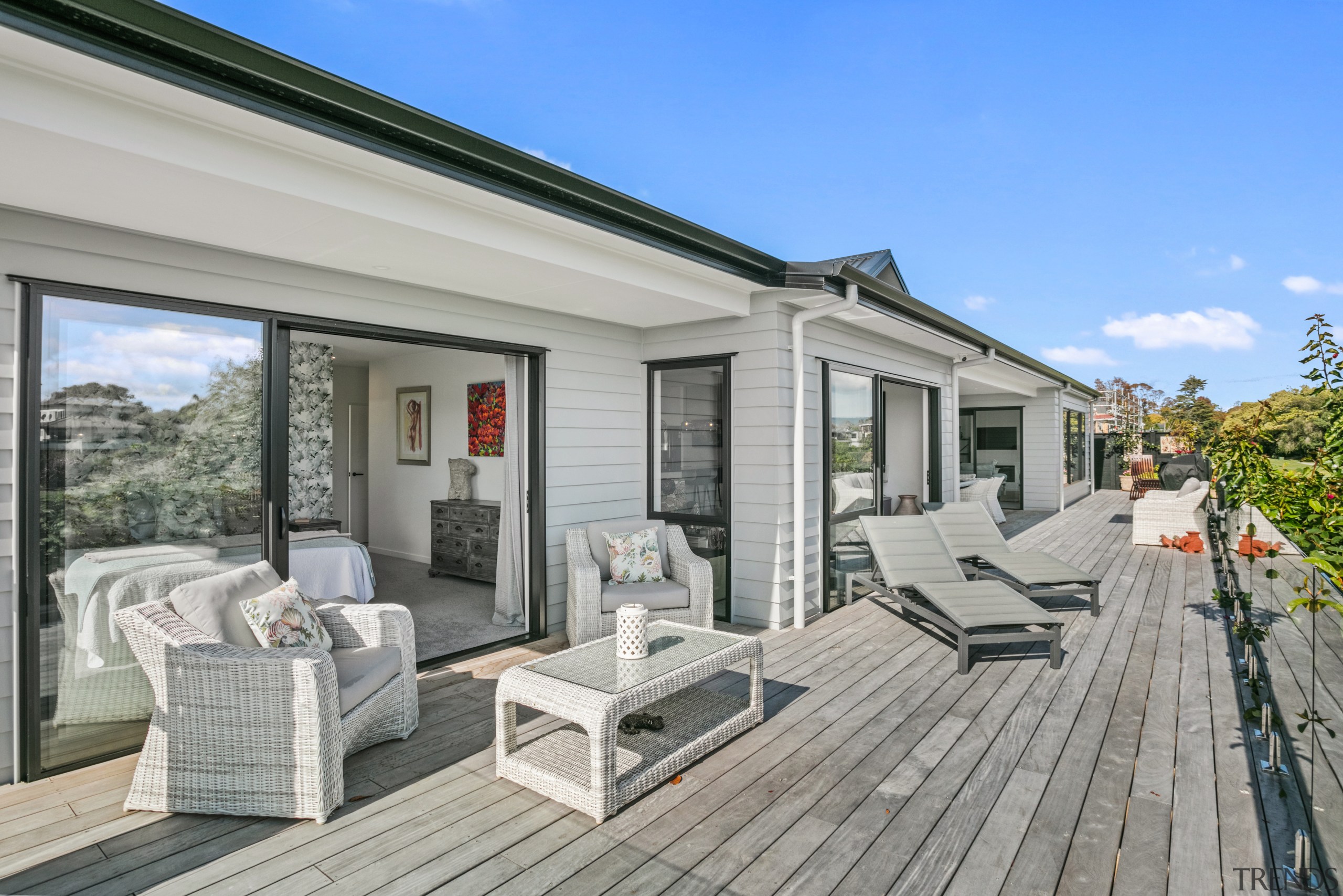 Thanks to a sprawling deck, the home embraces 