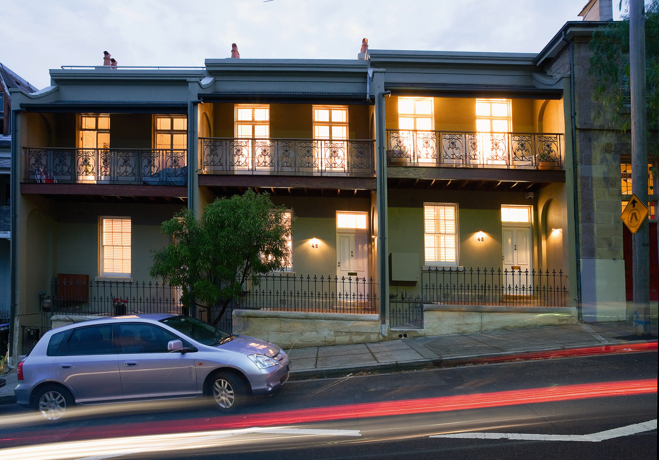 An exterior view of the apartment complex. - architecture, building, car, city, facade, family car, home, house, mixed use, neighbourhood, real estate, residential area, window, black