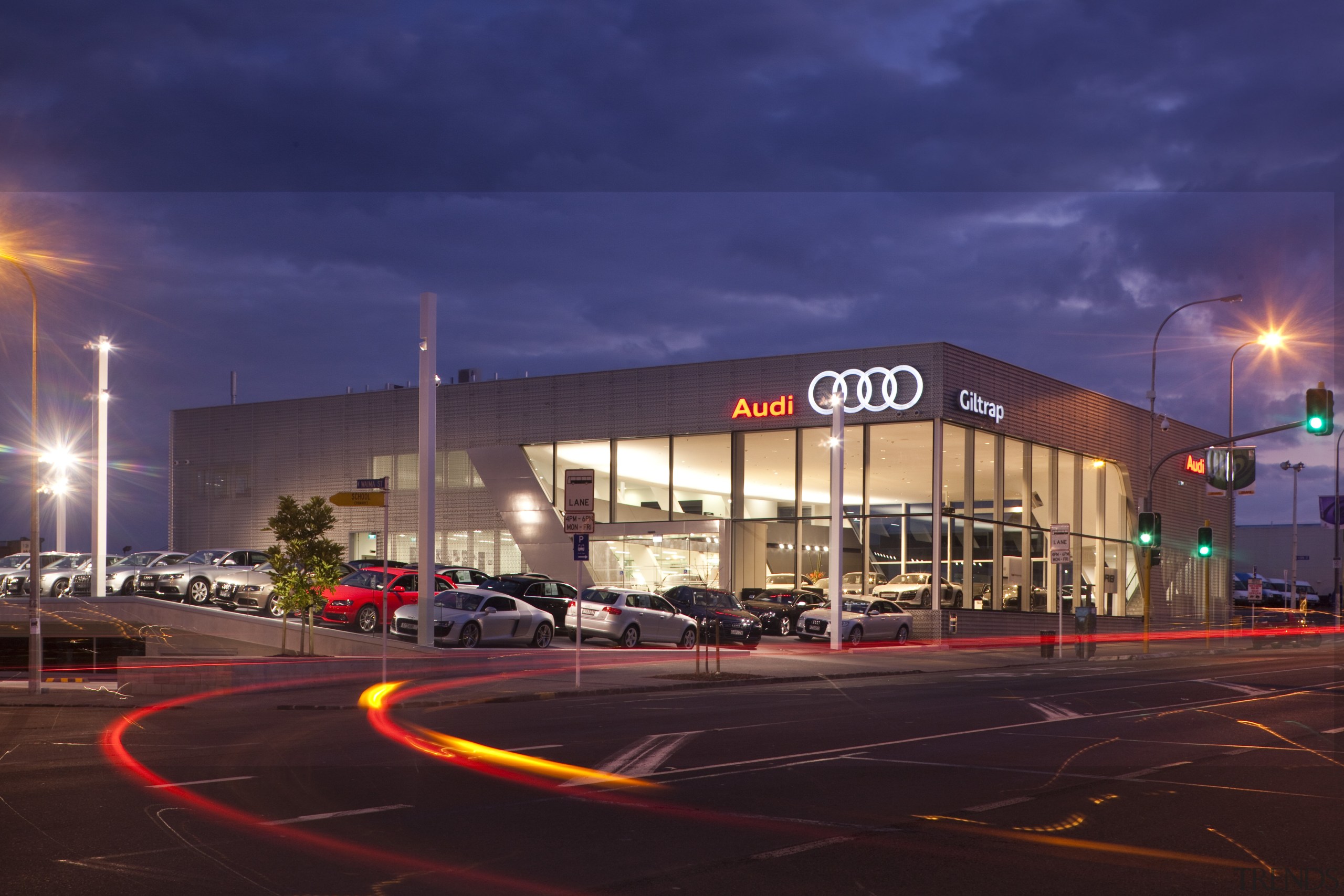 The aluminum facade and metal work was done architecture, building, car, city, downtown, dusk, evening, landmark, metropolitan area, night, sky, urban area, red, blue