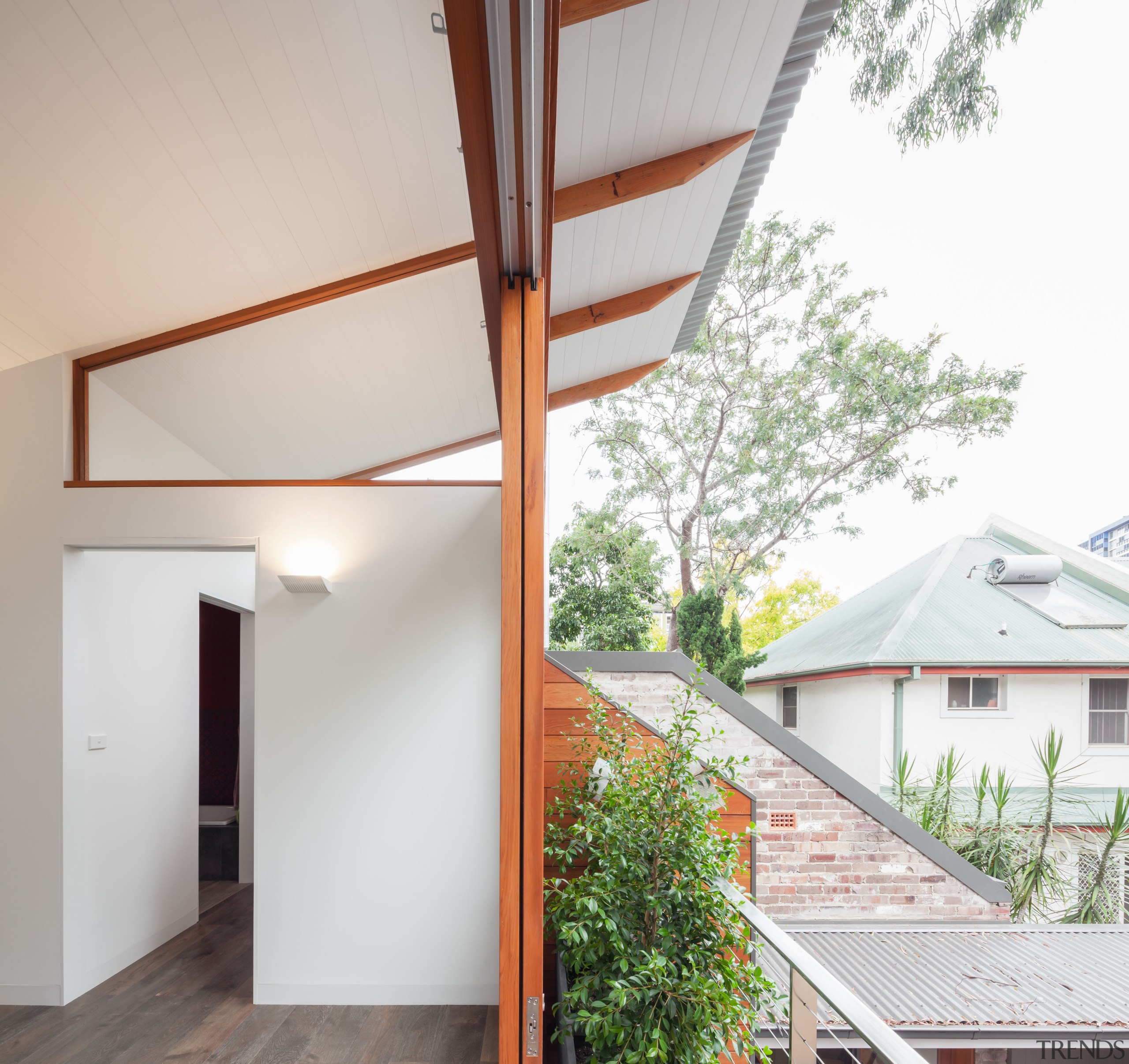 Reminiscent of a Japanese courtyard house, this house architecture, ceiling, daylighting, estate, facade, home, house, interior design, property, real estate, roof, window, white