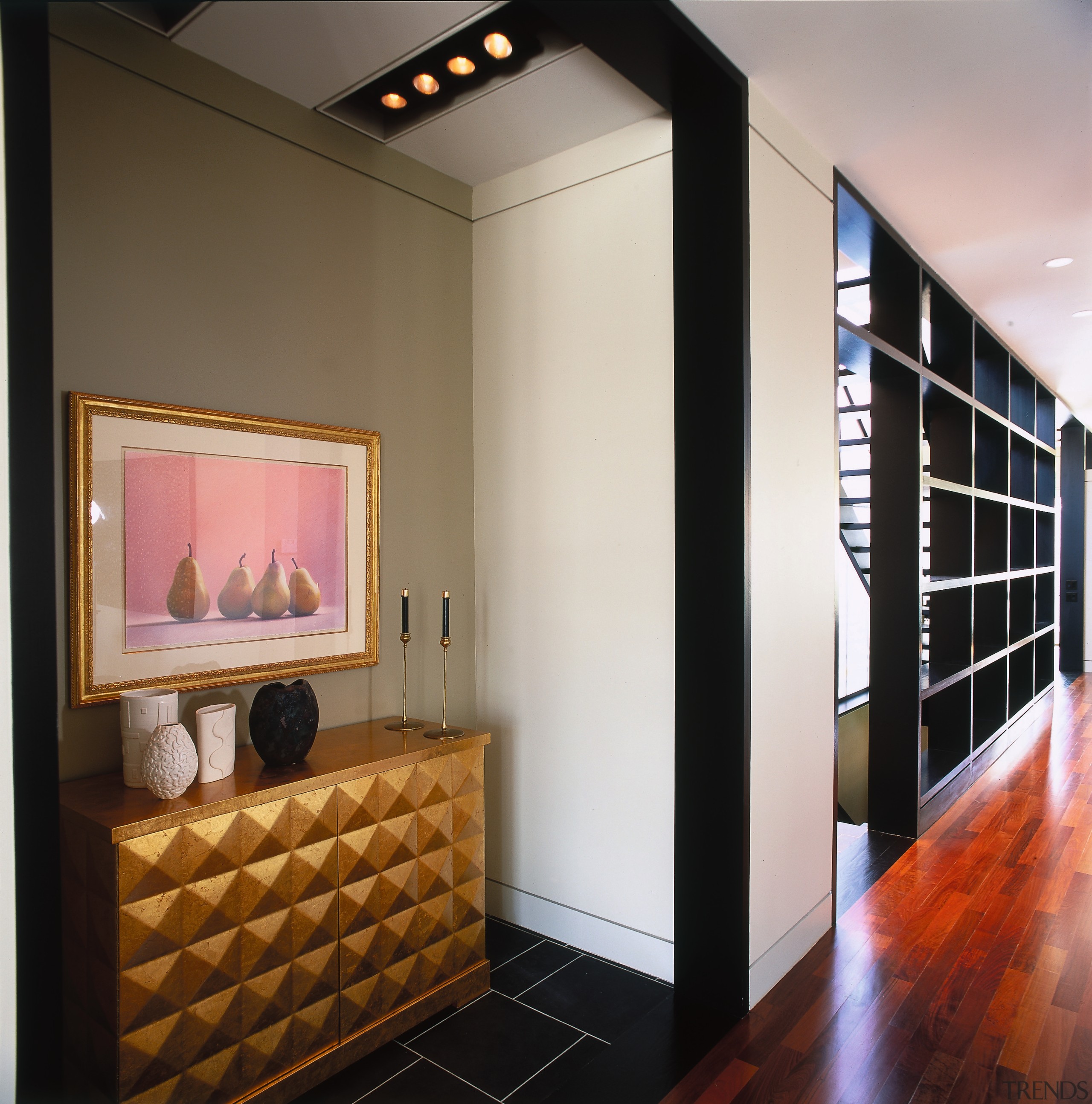 A view of a hallway, wooden flooring, beams ceiling, flooring, interior design, room, wall, gray, black, brown