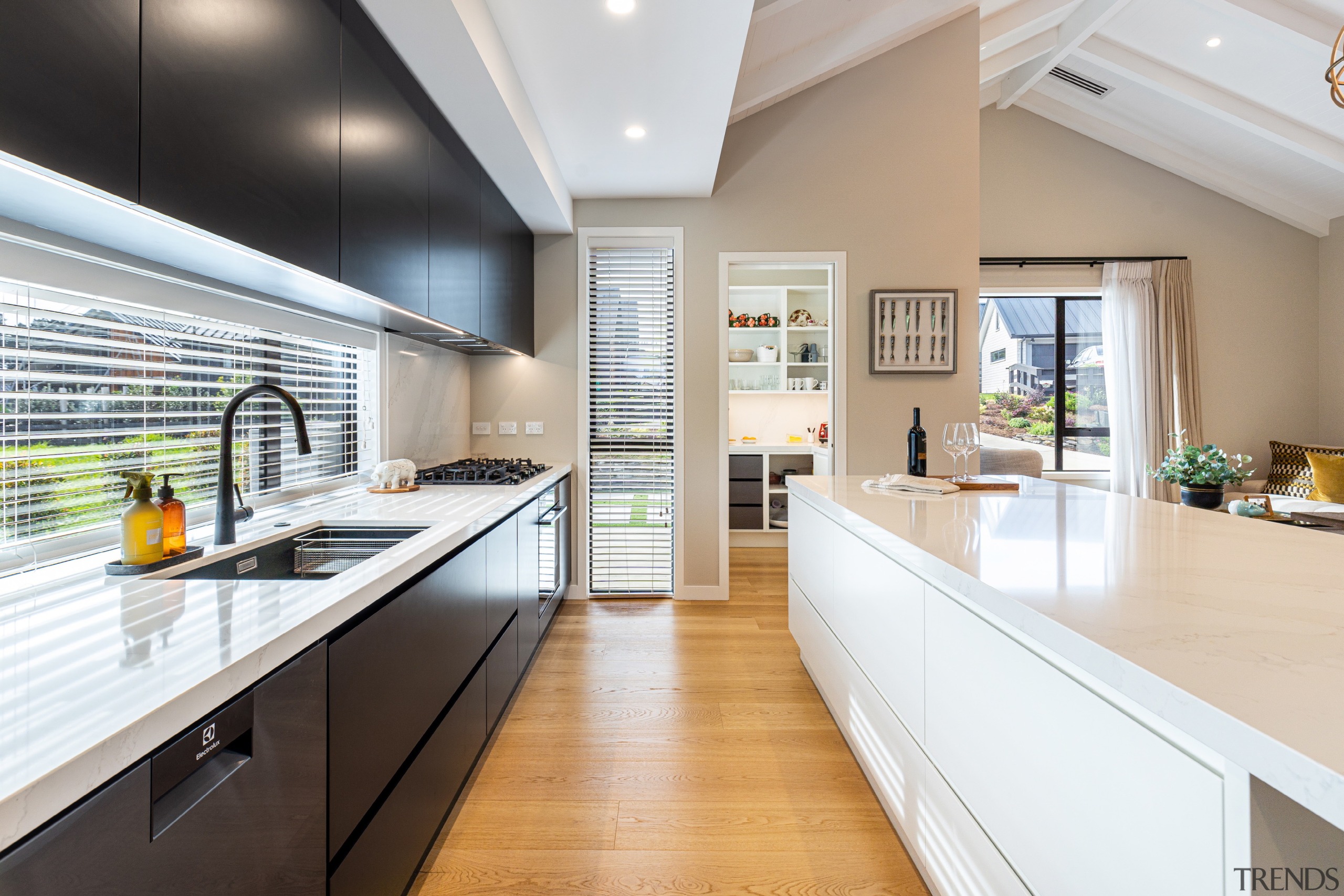 Contemporary kitchen with window splashback. 