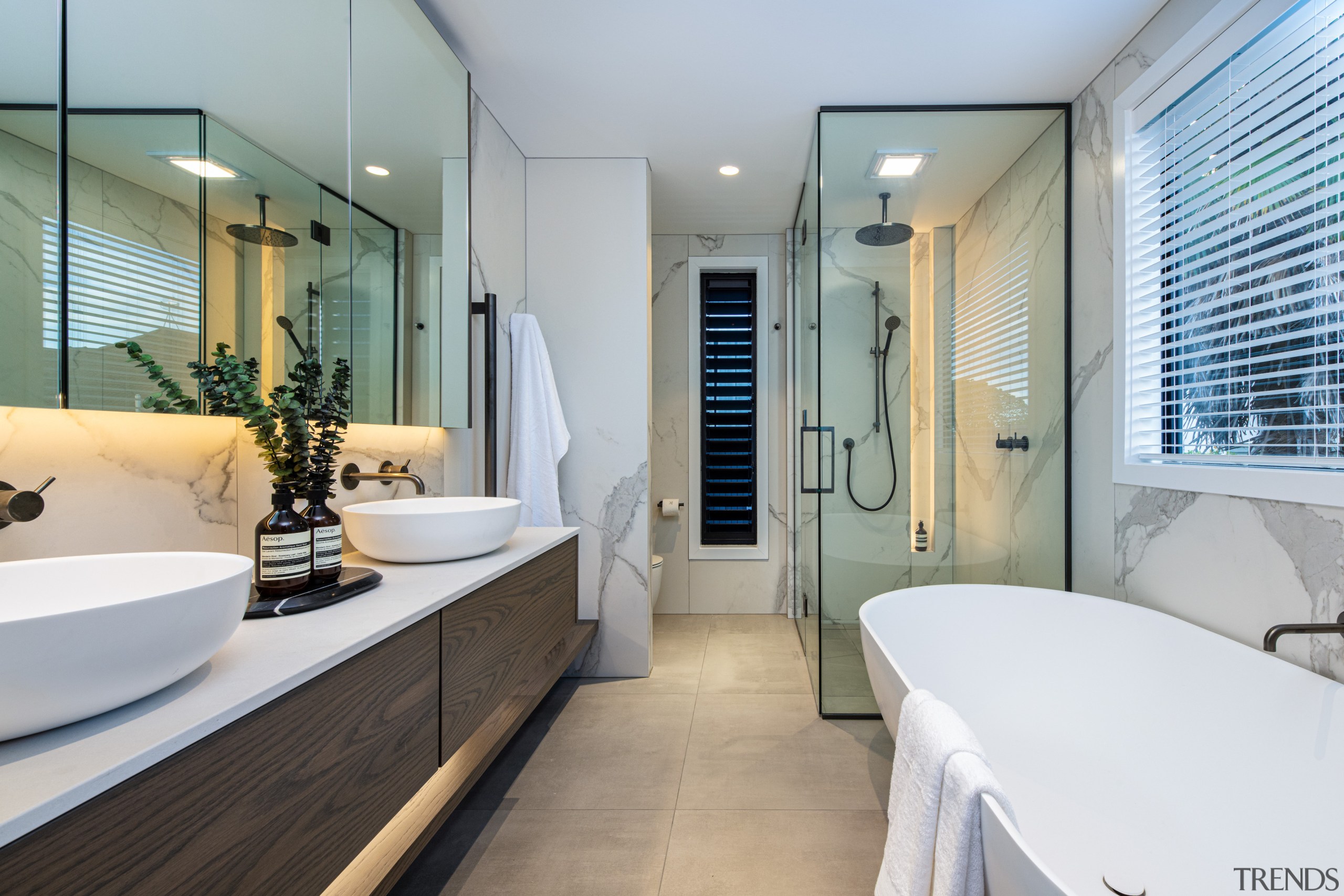 Designer bathroom complete with cantilevered vanity, freestanding tub 