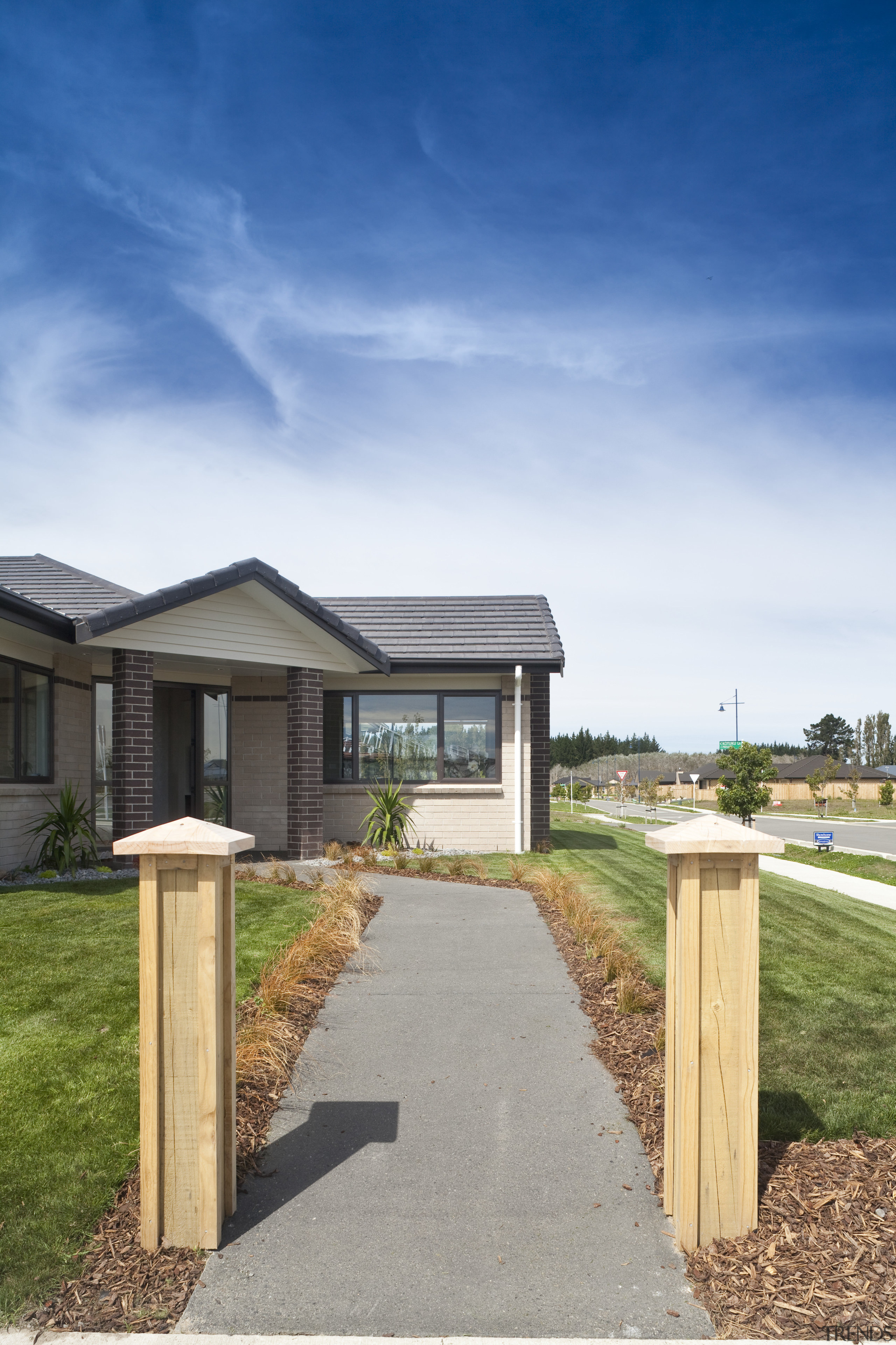 View of Platinum Homes show home with solid cloud, cottage, estate, facade, farmhouse, grass, home, house, land lot, landscape, property, real estate, residential area, siding, sky, suburb, walkway