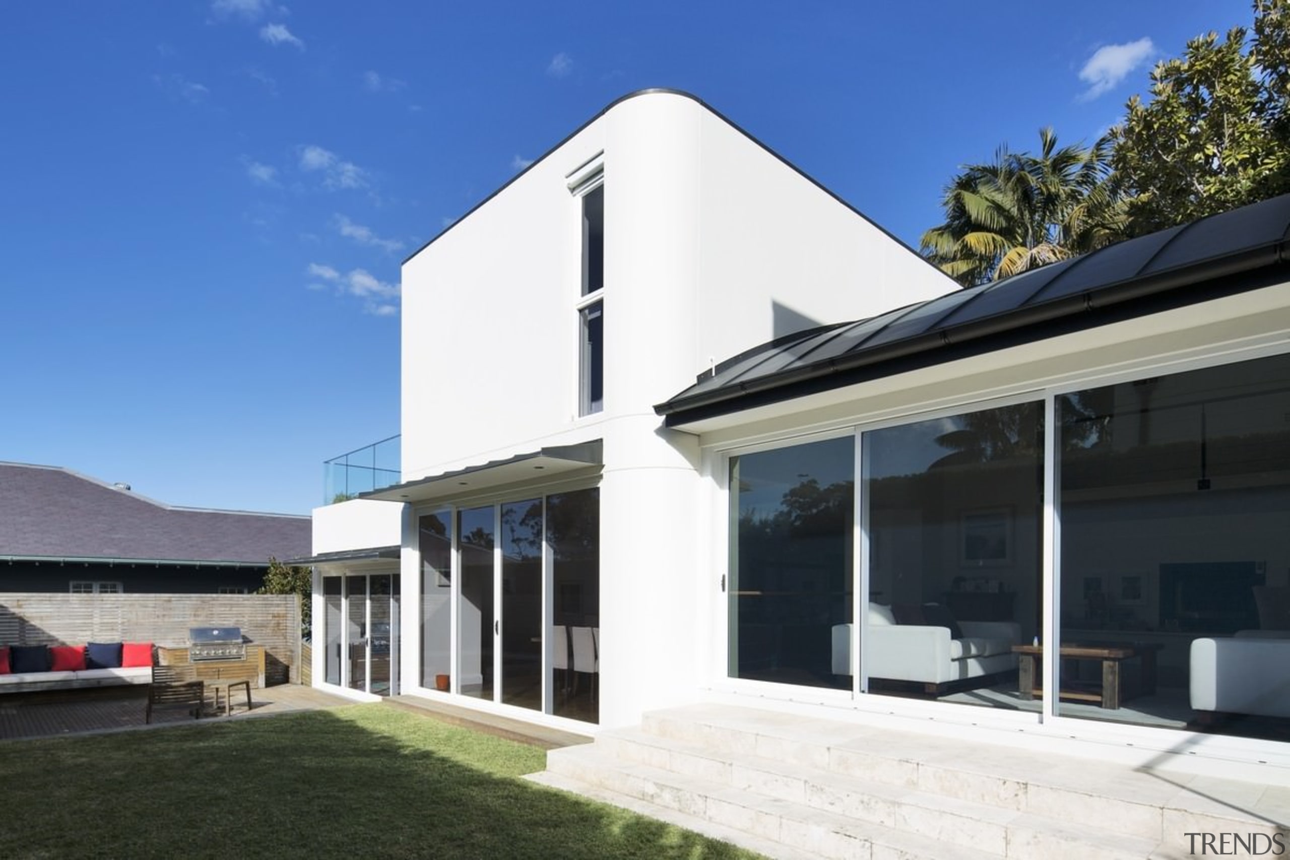 Another view of the yard and living area architecture, elevation, facade, home, house, property, real estate, residential area, roof, window, blue, black, white