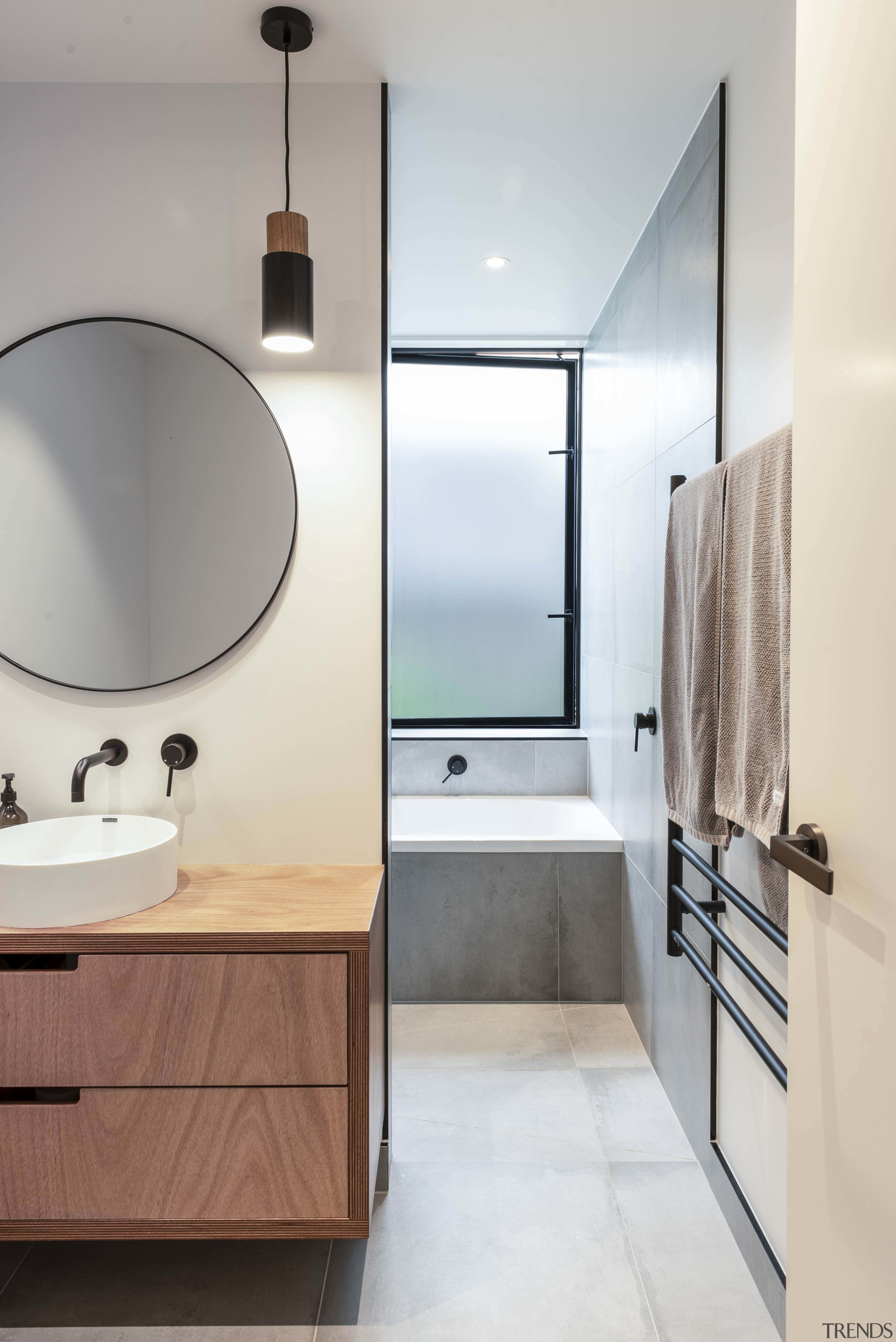 The main bathroom includes a corner tub, timber 