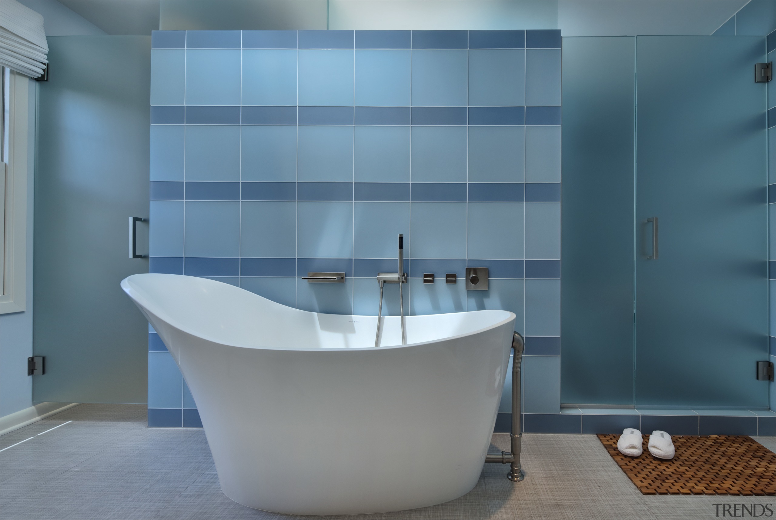 View of bathroom which features blue wall tiling, architecture, bathroom, bathtub, blue, floor, glass, interior design, plumbing fixture, product design, purple, room, tap, tile, wall, teal, gray