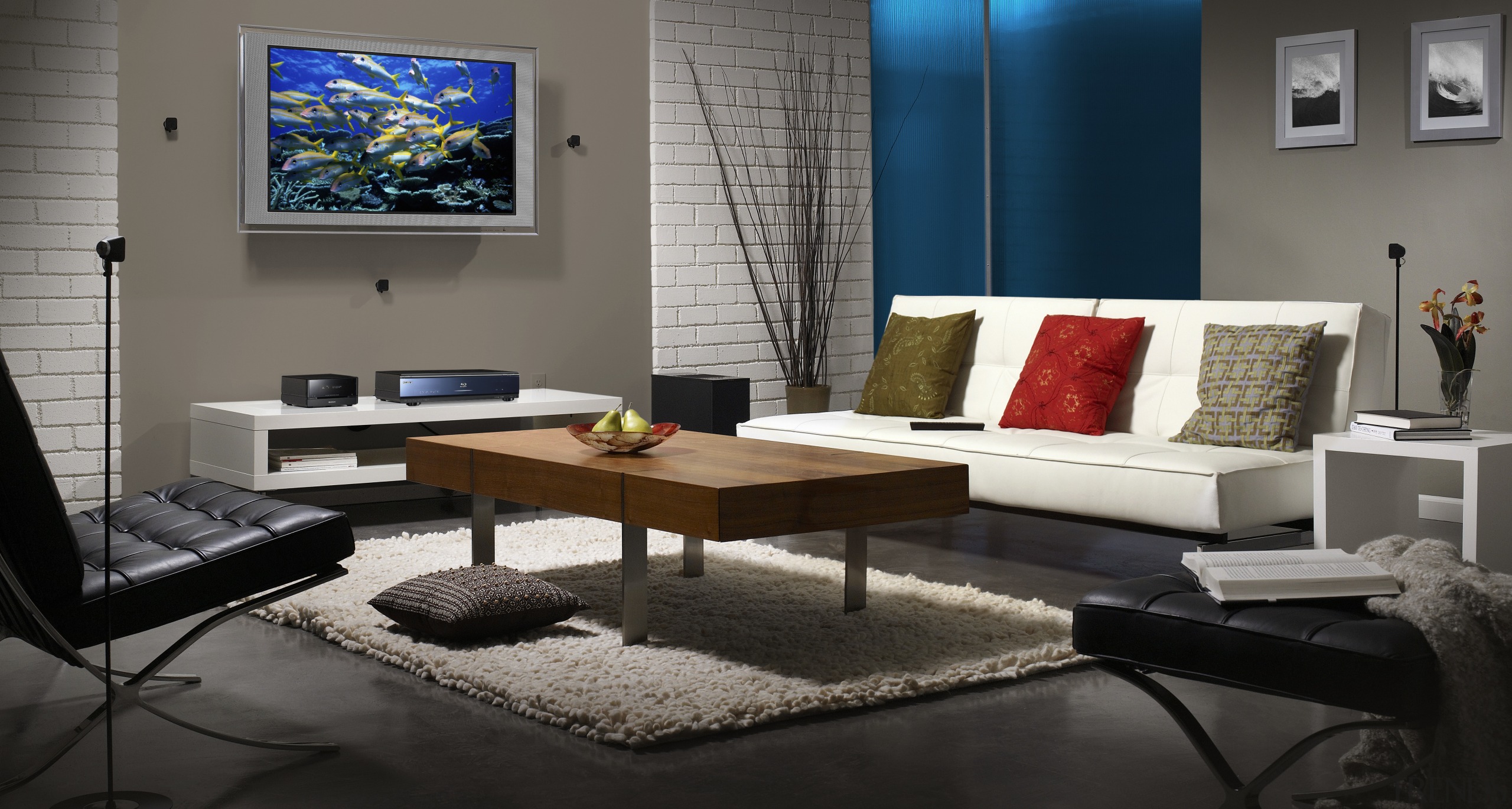 A view of a home theatre system from coffee table, couch, furniture, home, interior design, living room, room, table, gray, black