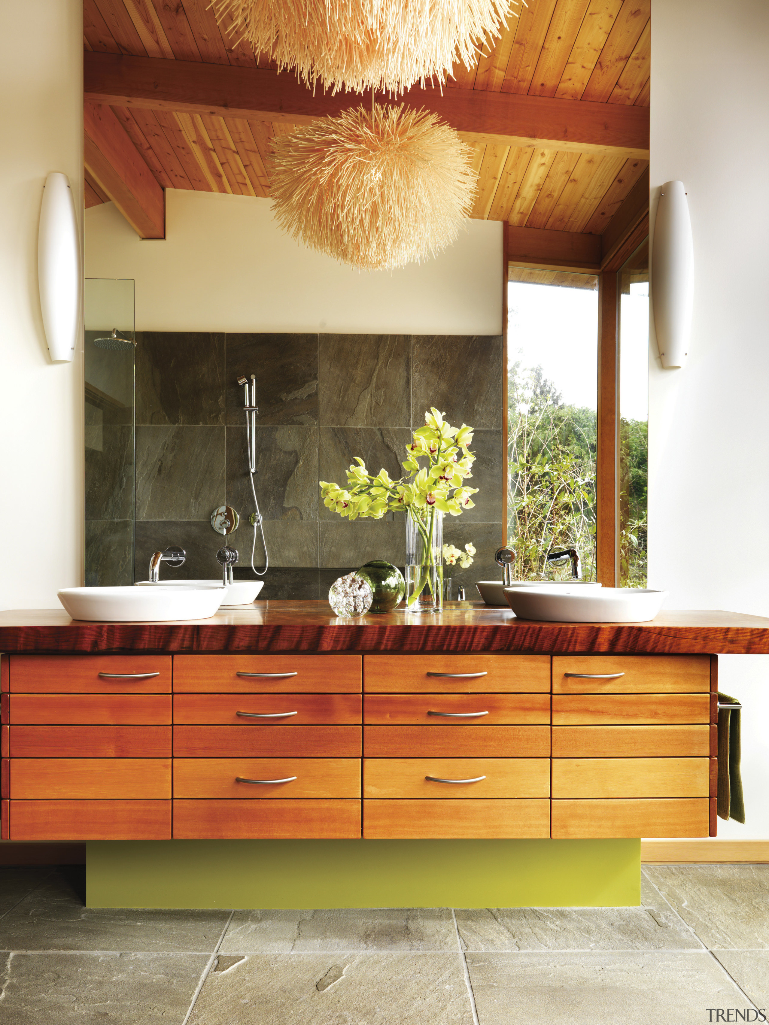 View of bathroom with wooden vanity and dark cabinetry, ceiling, chest of drawers, countertop, cuisine classique, floor, furniture, hardwood, home, interior design, kitchen, orange, room, table, wall, red