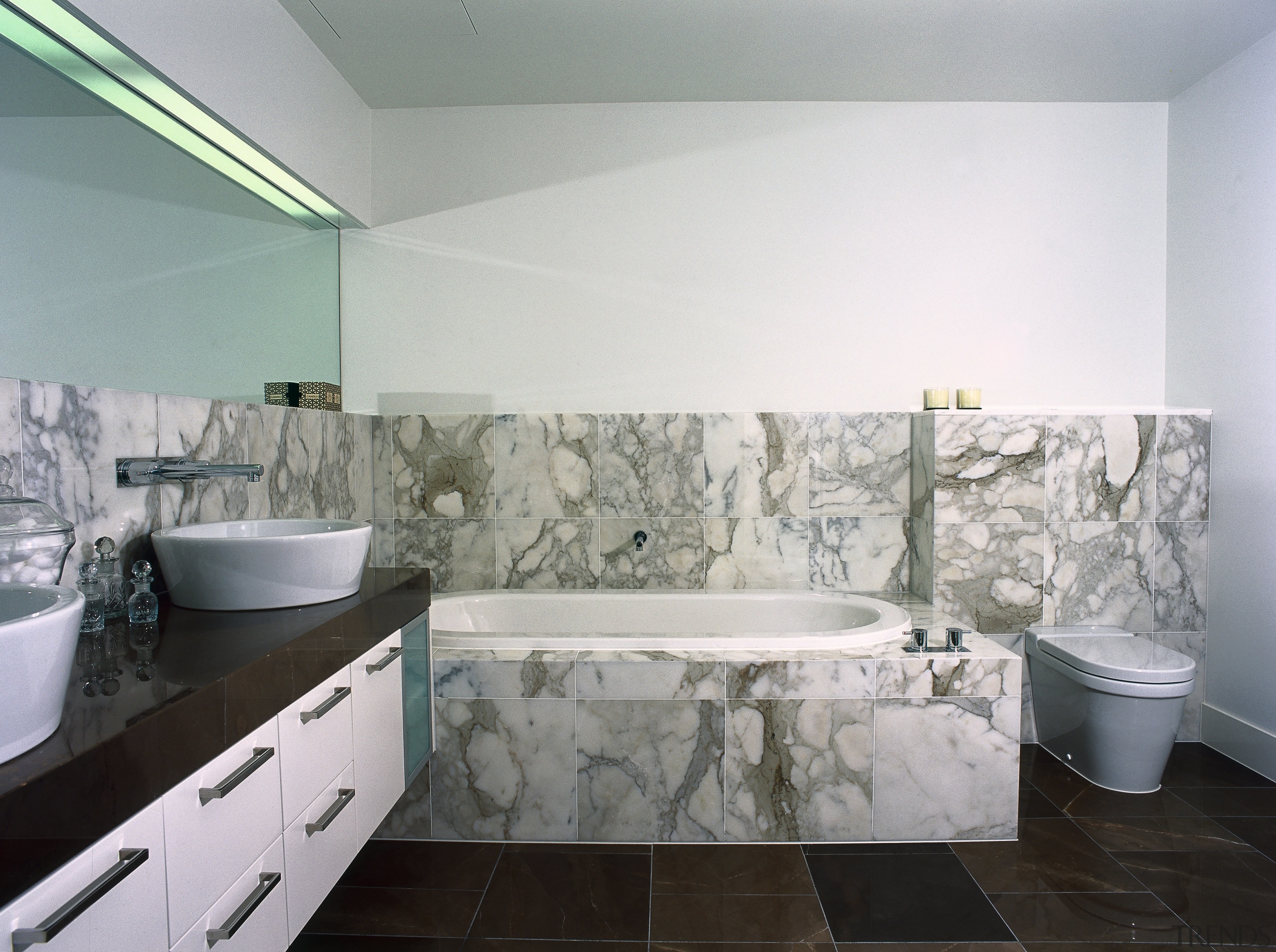 bathrooms features marble tiling on the floor and architecture, bathroom, bathtub, floor, flooring, interior design, property, room, tile, wall, gray