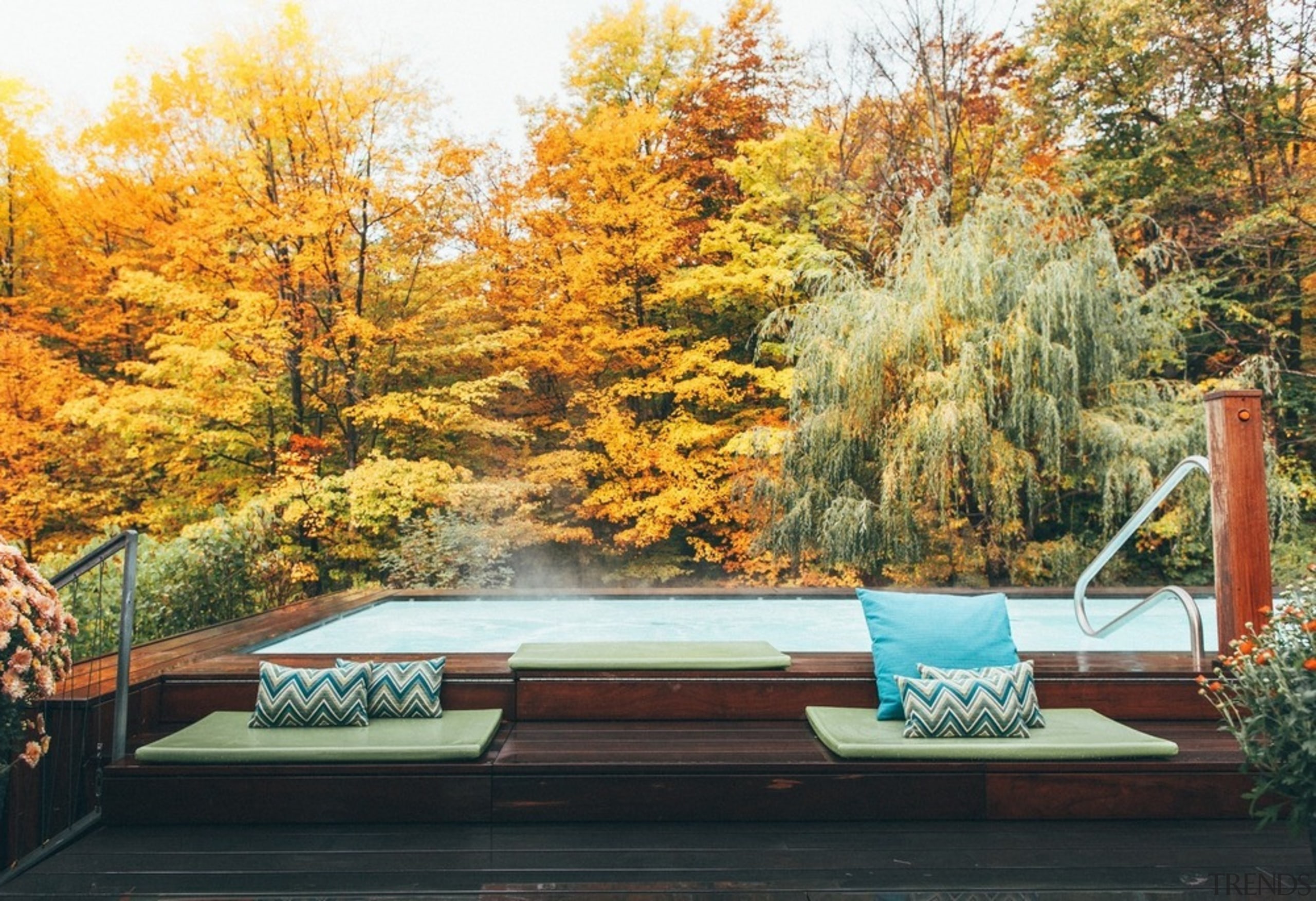 The enormous 1500 sq. ft. terrace features clean autumn, furniture, home, house, landscape, leaf, natural landscape, nature, plant, sky, table, tree, woody plant, orange