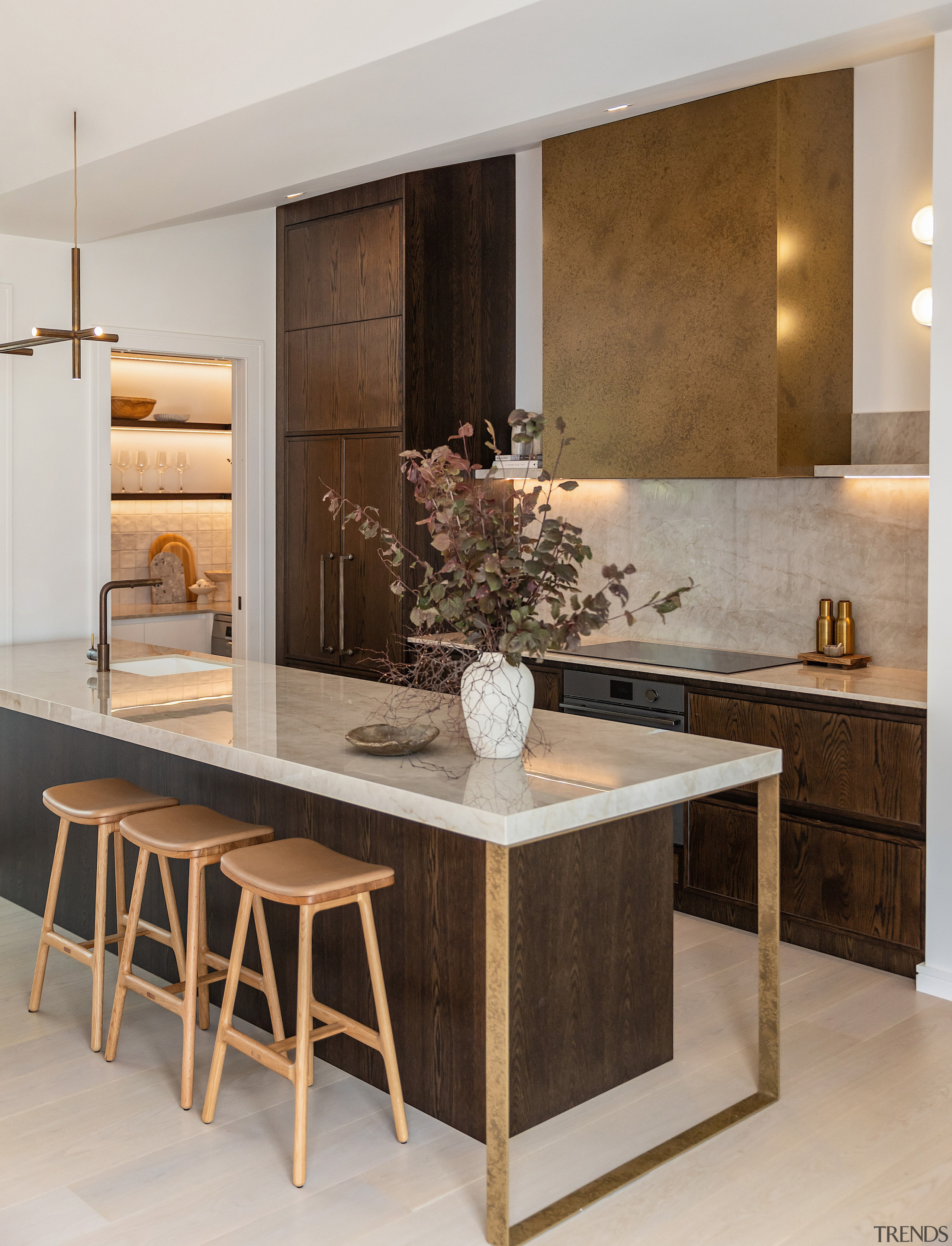 The kitchen island has a modern accent. - 