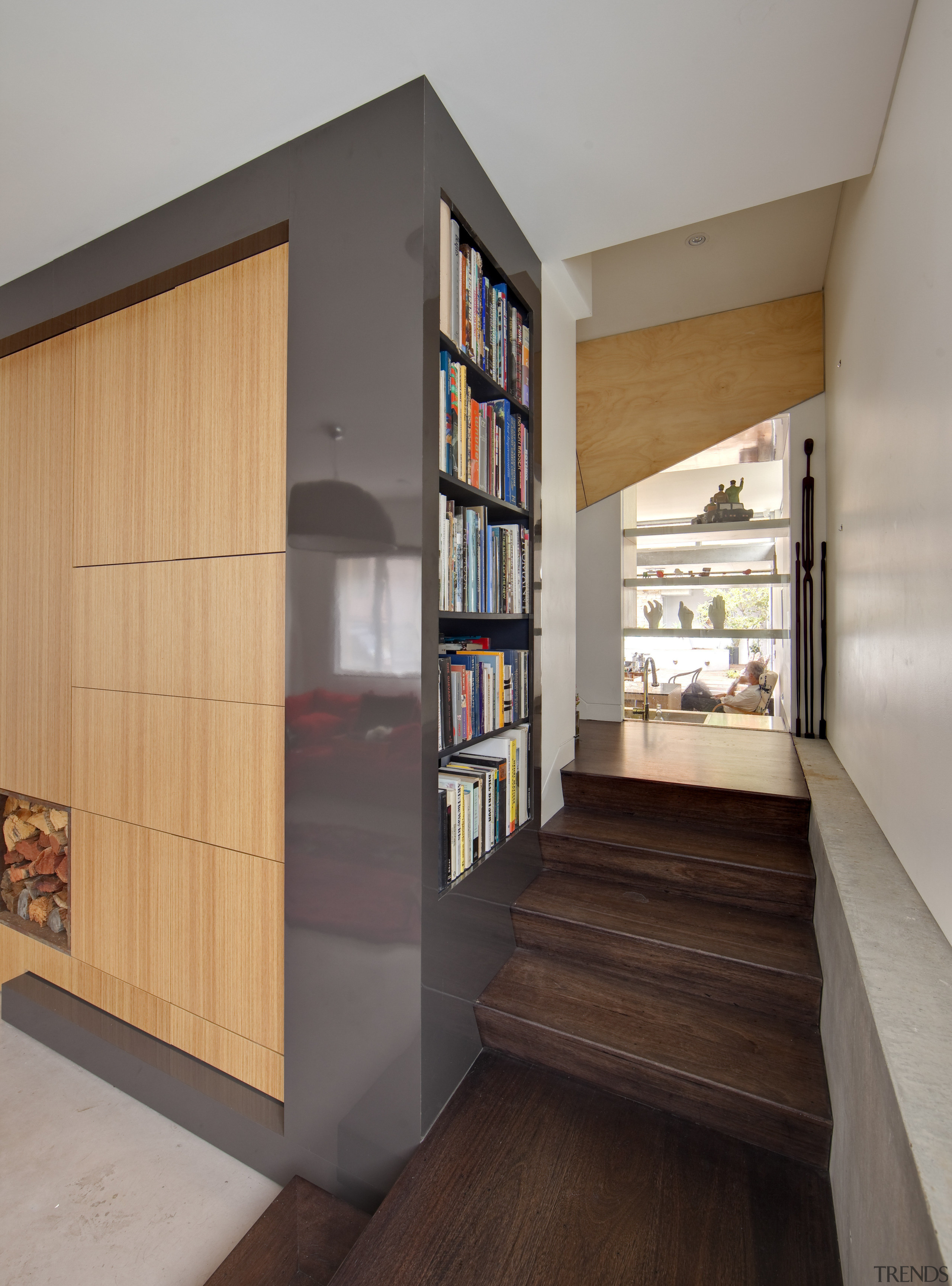 The view from the front door of this bookcase, furniture, interior design, shelf, shelving, gray