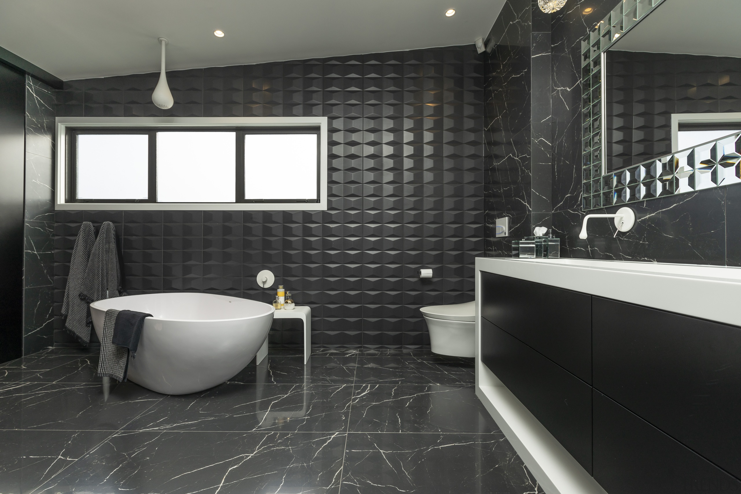 Given a large space for this master bathroom, black, countertop, floor, flooring, interior design, room, tile, wall, black