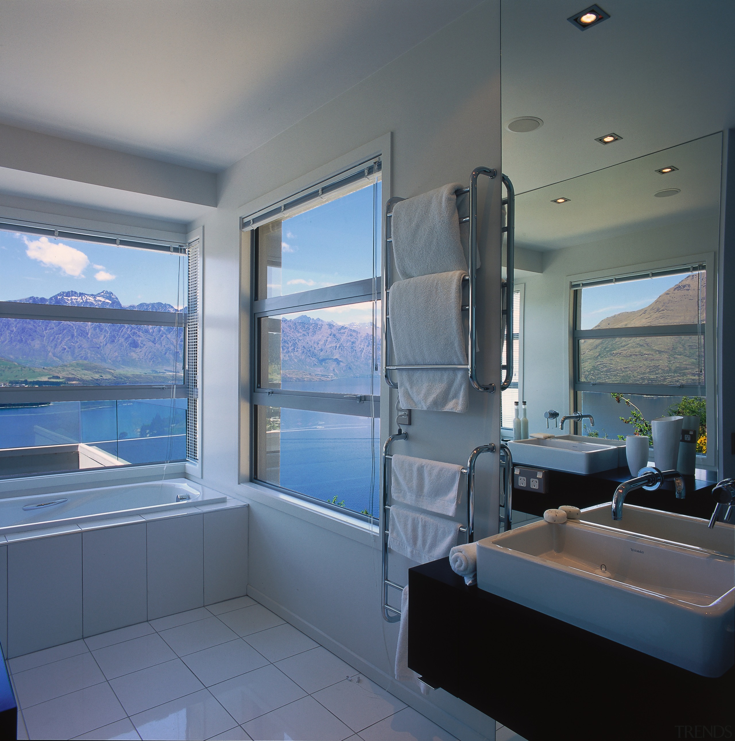 A view of a bathroom, wooden vanity, white bathroom, interior design, real estate, room, window, gray