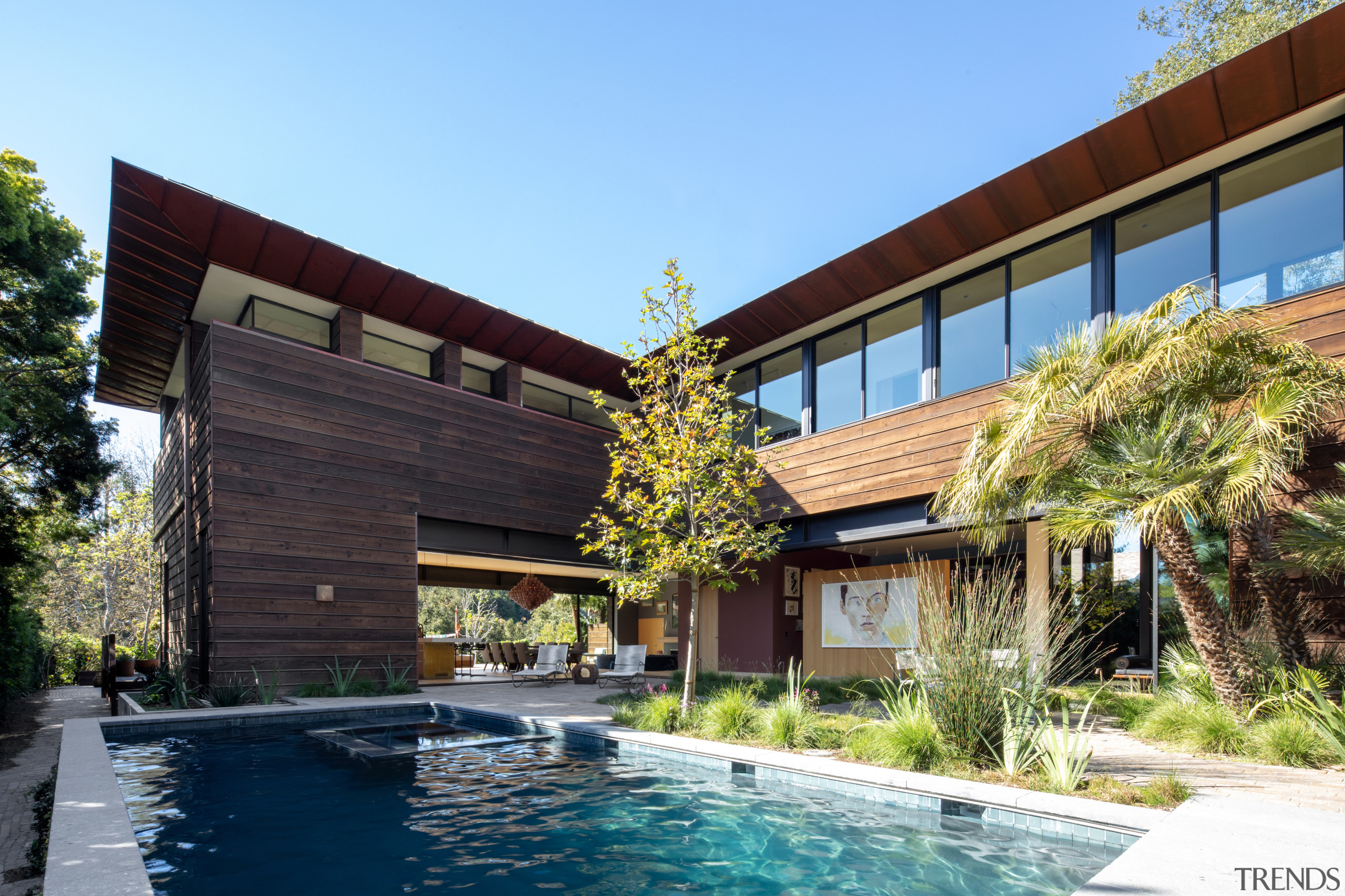 The pool features a Heath Ceramics tile border 