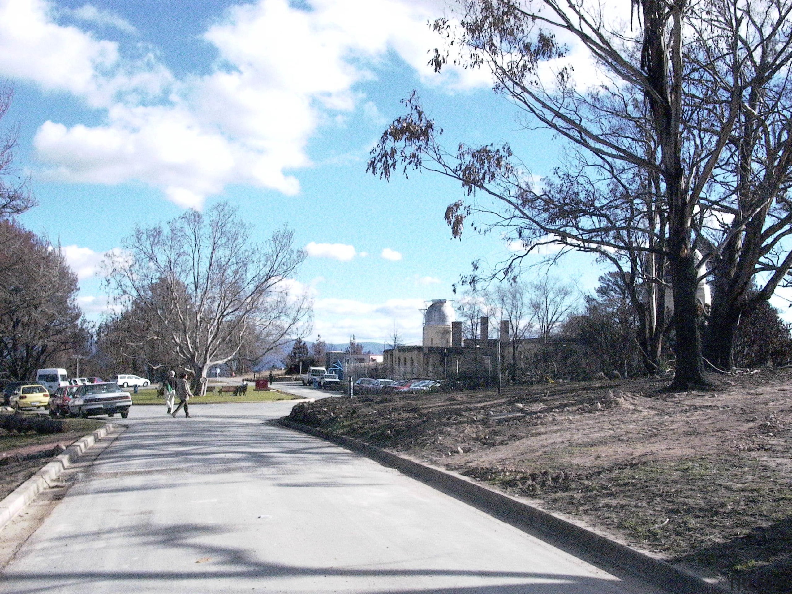 View of the observatory prior to renovations after area, asphalt, cloud, infrastructure, lane, neighbourhood, path, plant, residential area, road, road surface, sky, suburb, town, tree, winter, woody plant, white