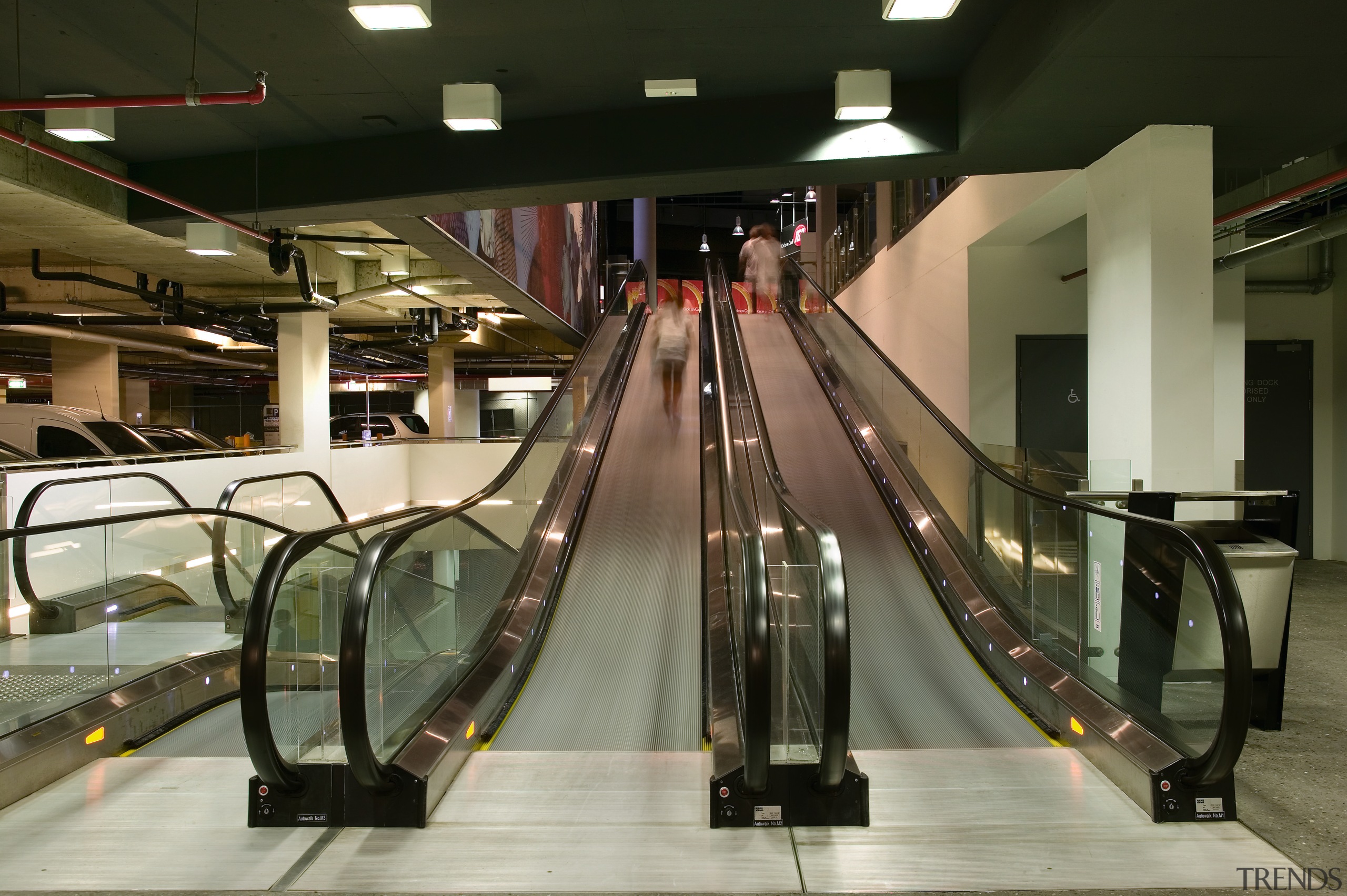 A view of the four moving escalator walkways escalator, brown, black