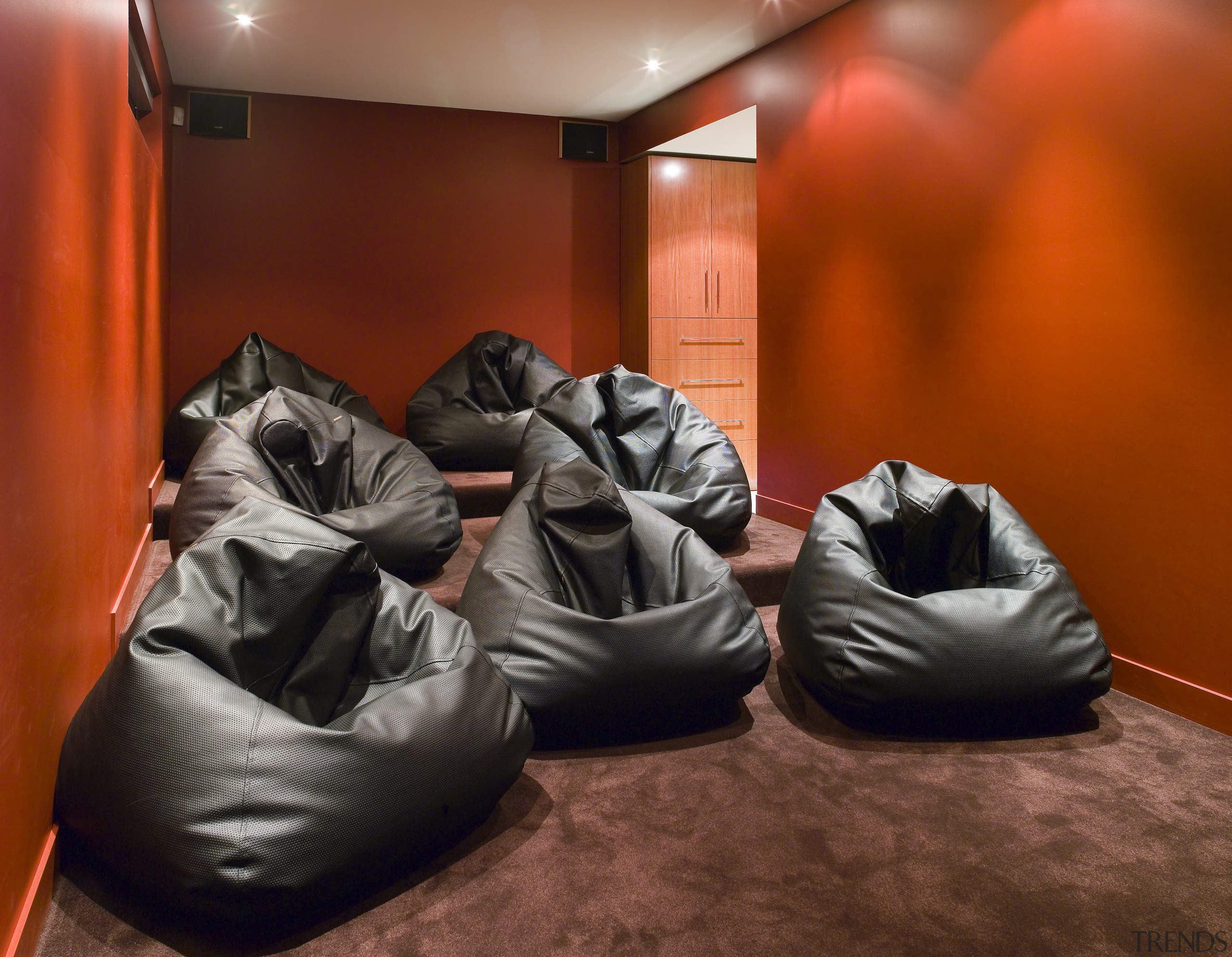 A view of an home theatre system witch couch, furniture, room, red