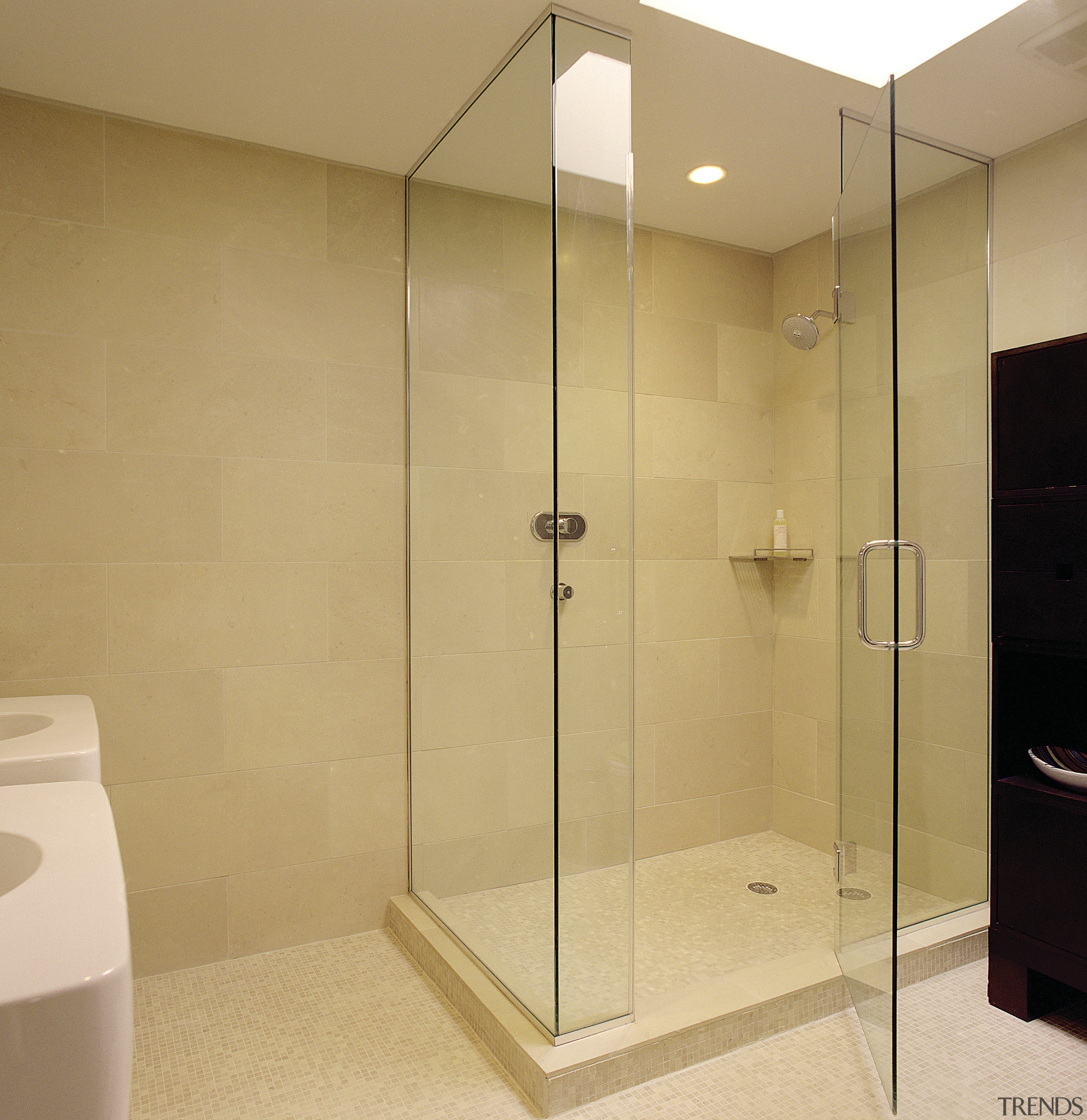 A view of this bathroom featuring glass shower bathroom, floor, glass, plumbing fixture, room, shower, orange