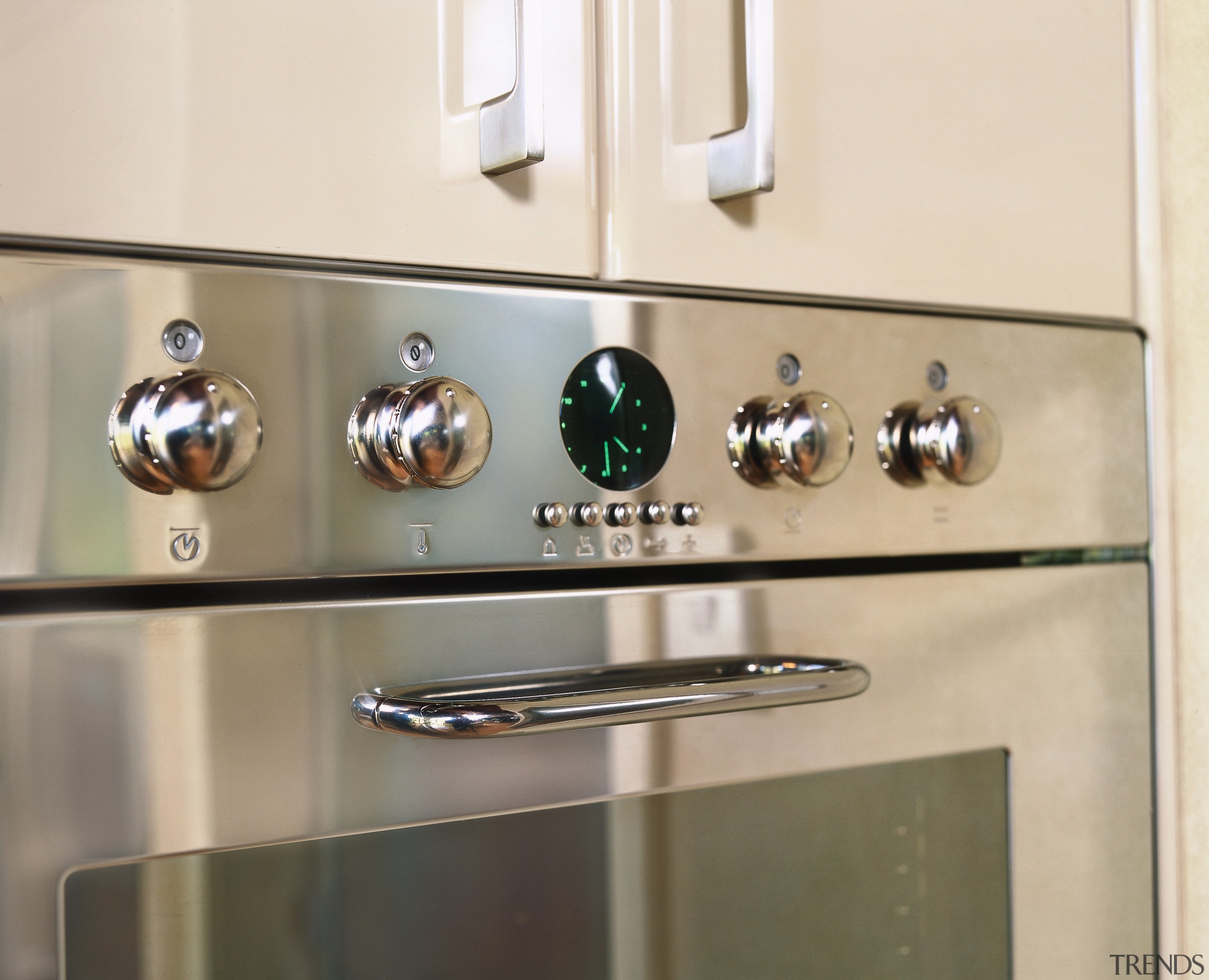 Wall oven with stainless steel finish. - Wall tap, orange