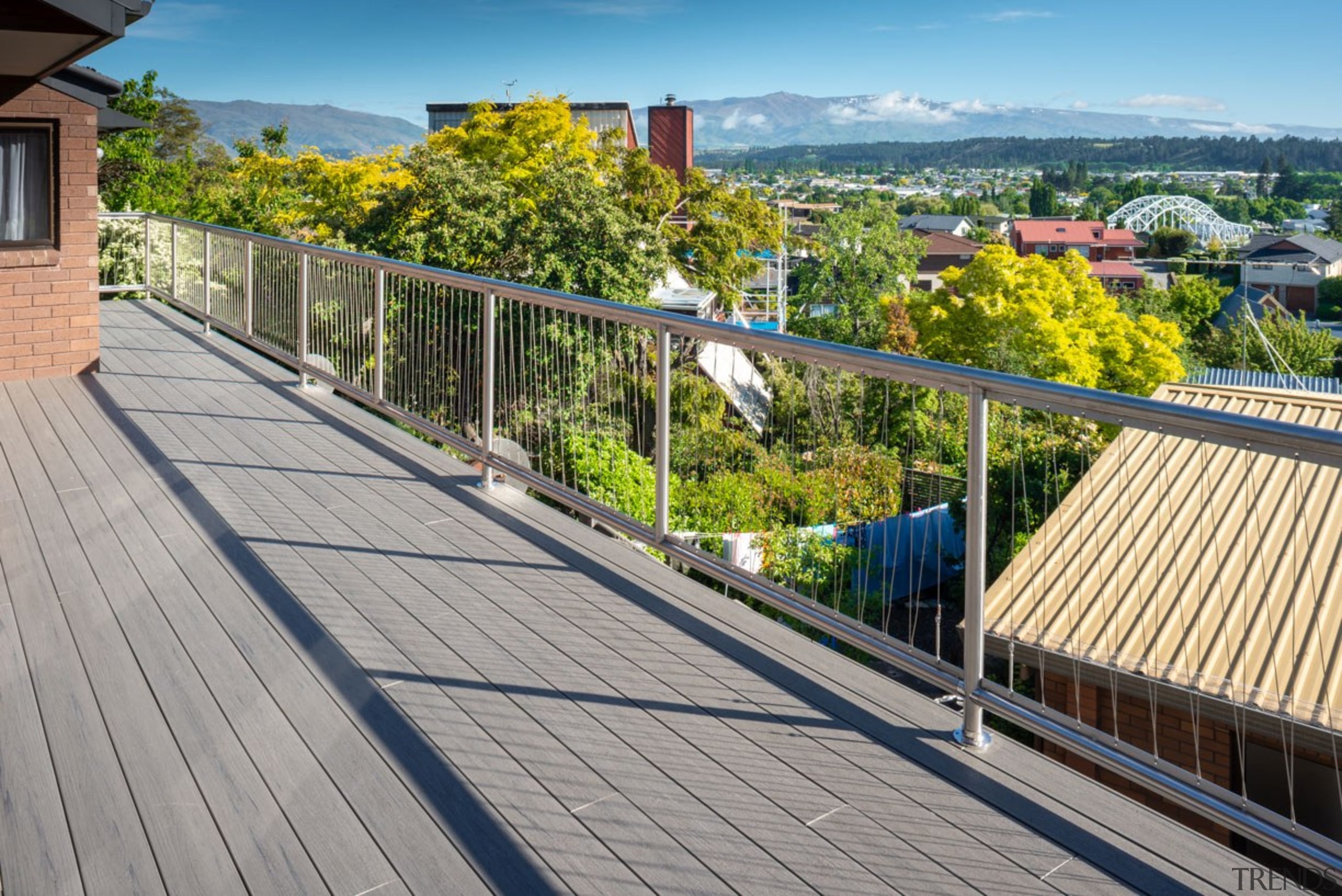 As Stunning As The Views This Terrain Deck boardwalk, deck, guard rail, handrail, outdoor structure, property, real estate, residential area, roof, walkway, gray