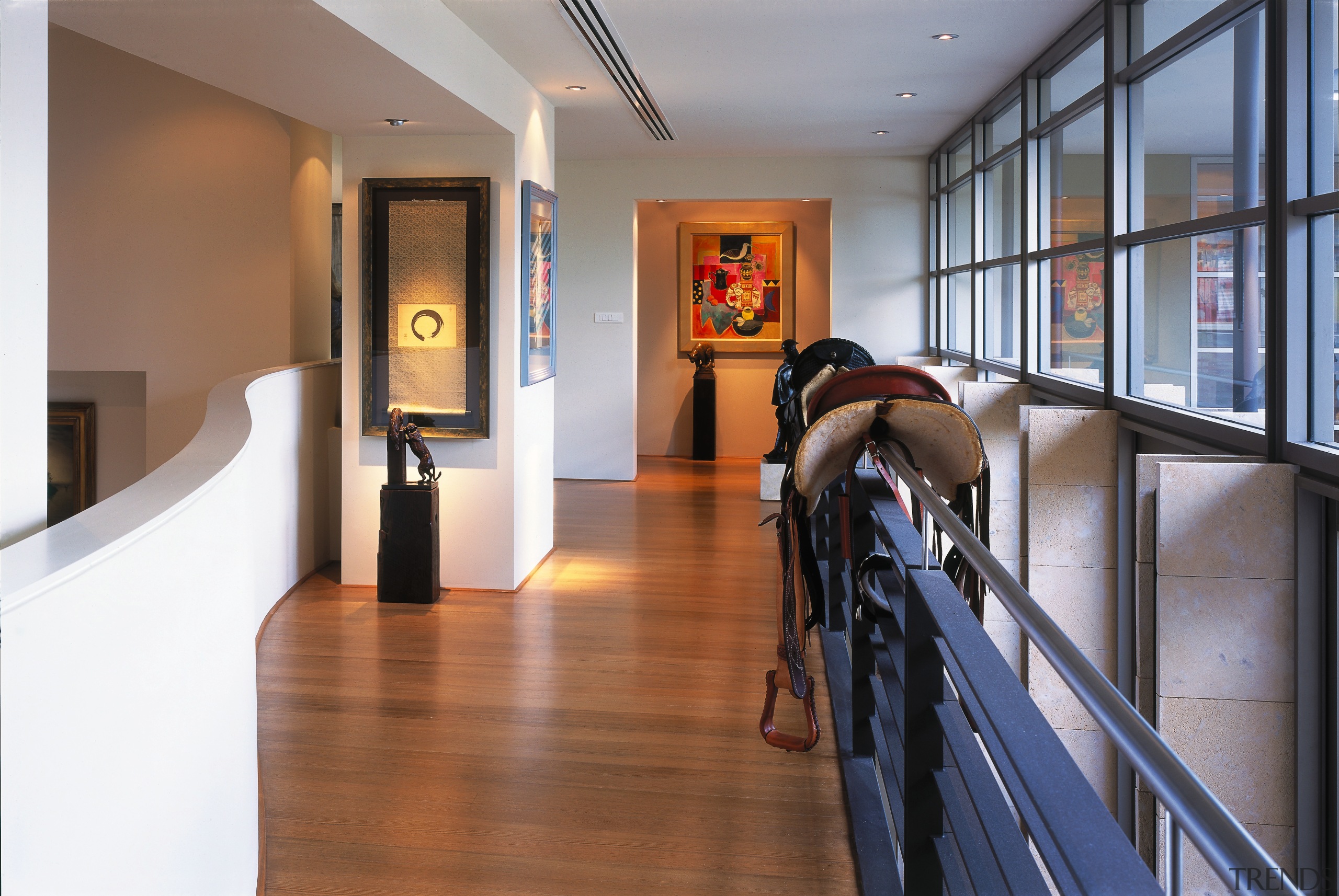 view of the artwork featuring various artworks and apartment, floor, flooring, interior design, real estate, brown