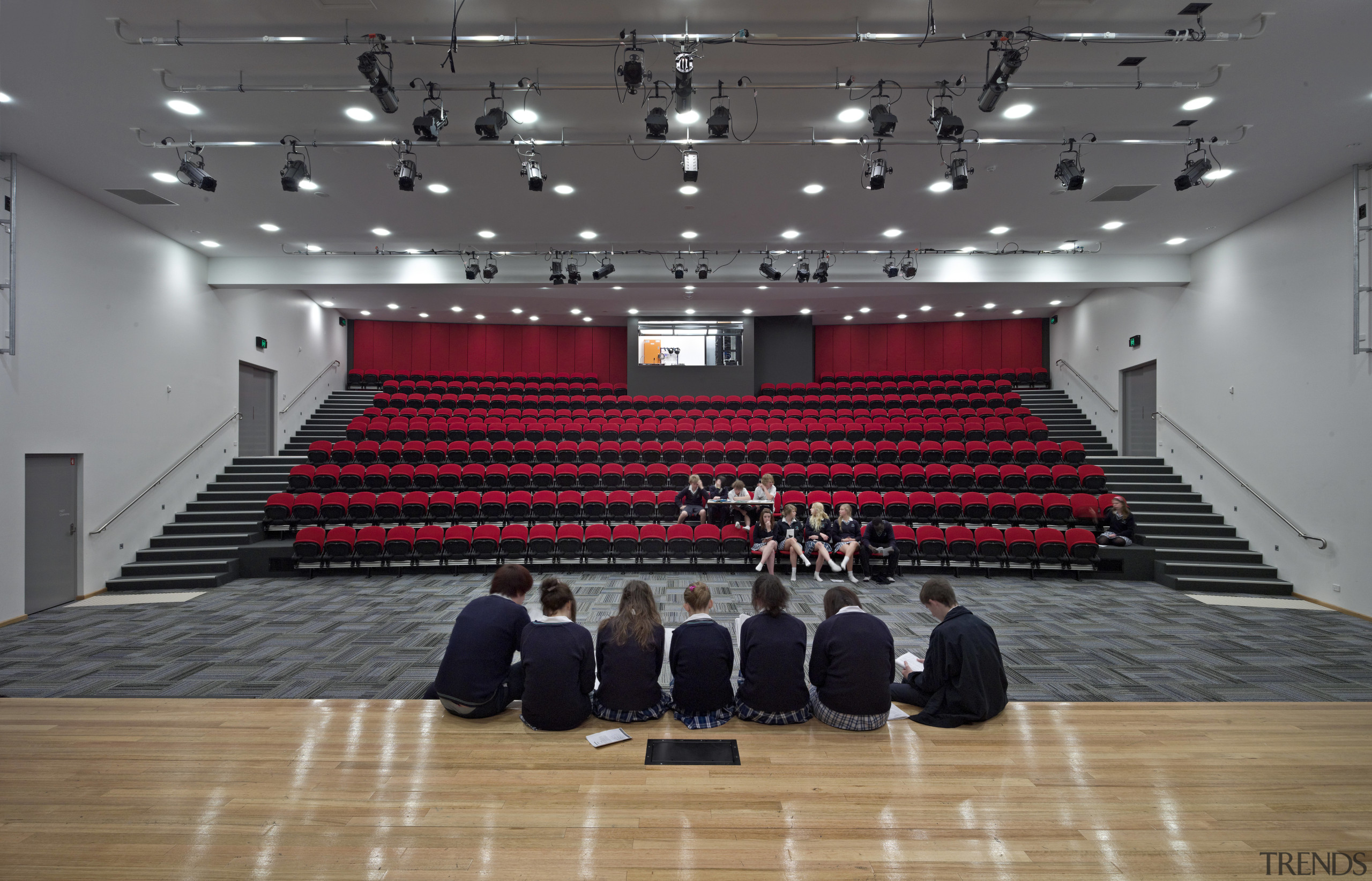 View of auditorium with red seating and students audience, auditorium, performing arts center, red, sport venue, structure, theatre, gray